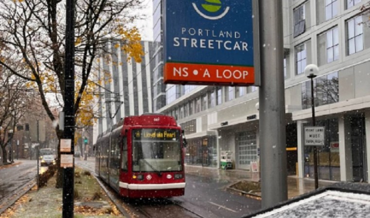 A Portland Streetcar on Southwest Harrison during a snow event, December 4, 2022 (Portland Streetcar)