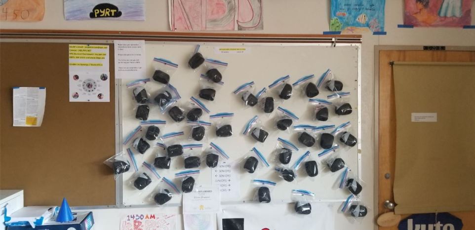 Microphone windsreens hang on a wall n the KBPS classroom. Photo courtesy Jacob Patterson