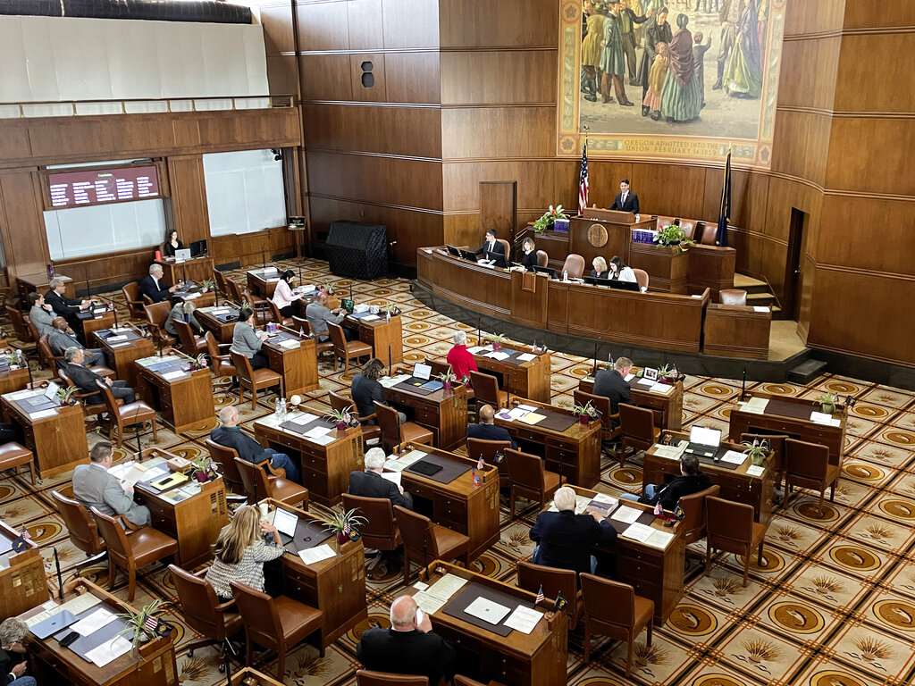 The Oregon state Senate convenes for the first day of the legislative session on Tuesday, Jan. 17, 2023, at the state Capitol in Salem, Ore. (AP Photo/Claire Rush)