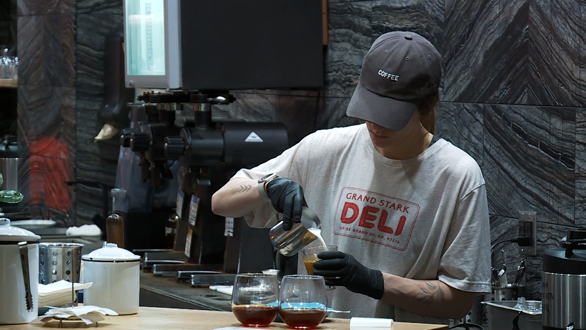 A barista makes a cup of coffee at Proud Mary Coffee Roasters in Portland on Feb. 7, 2023. (KOIN)