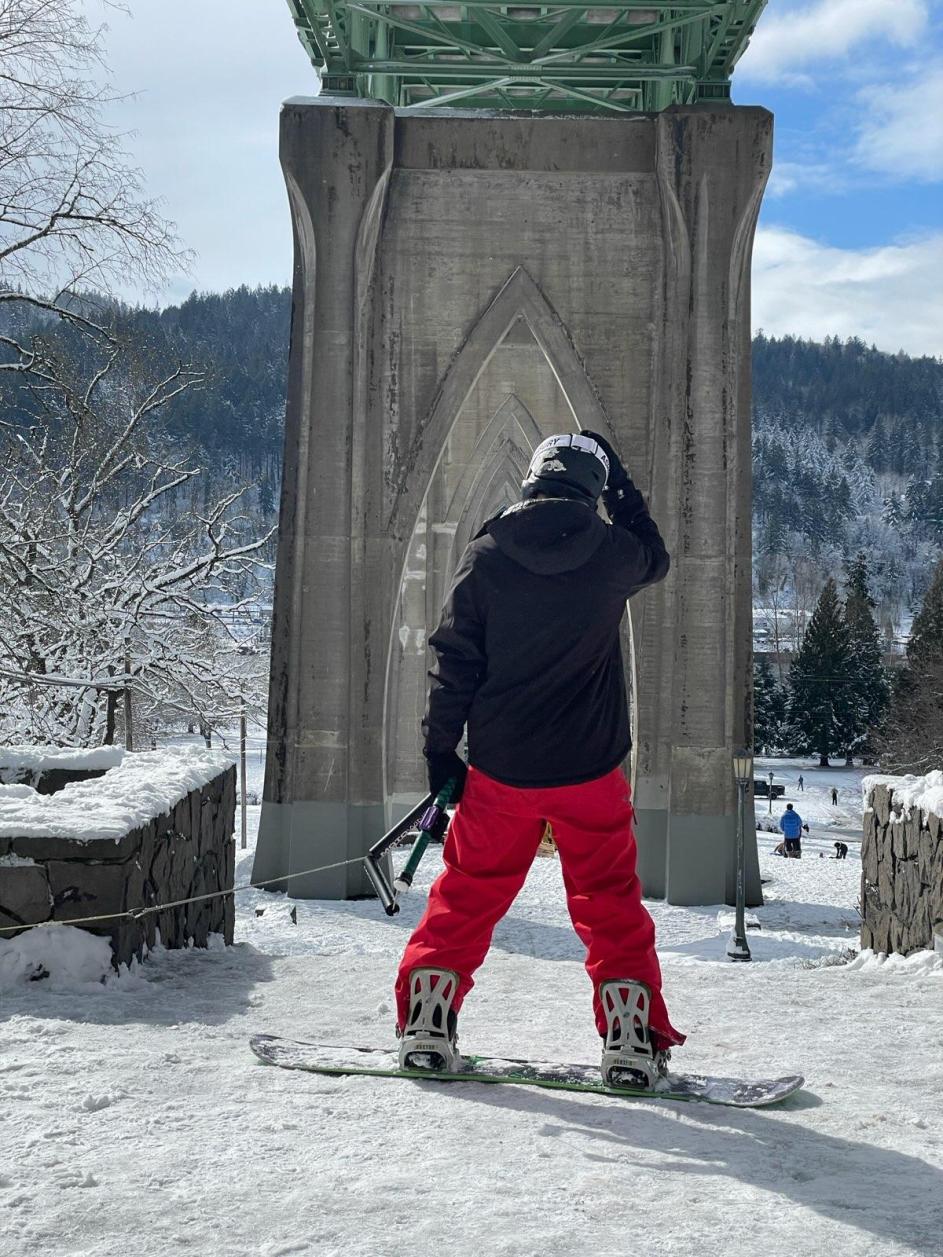 Snowboarder rides down Cathedral Park on Feb. 23, 2023