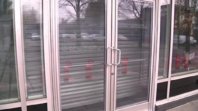 A metal grate covers the doors at the Nike store on MLK Boulevard in Portland, February 13, 2013 (KOIN)