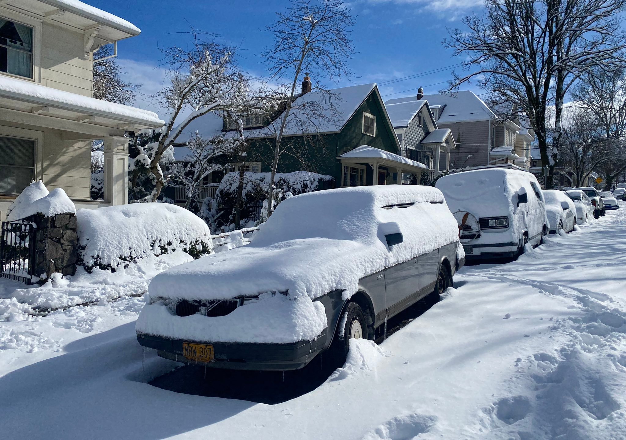 Snow blankets streets and parked vehicles in South Portland on Thursday, Feb. 23, 2023