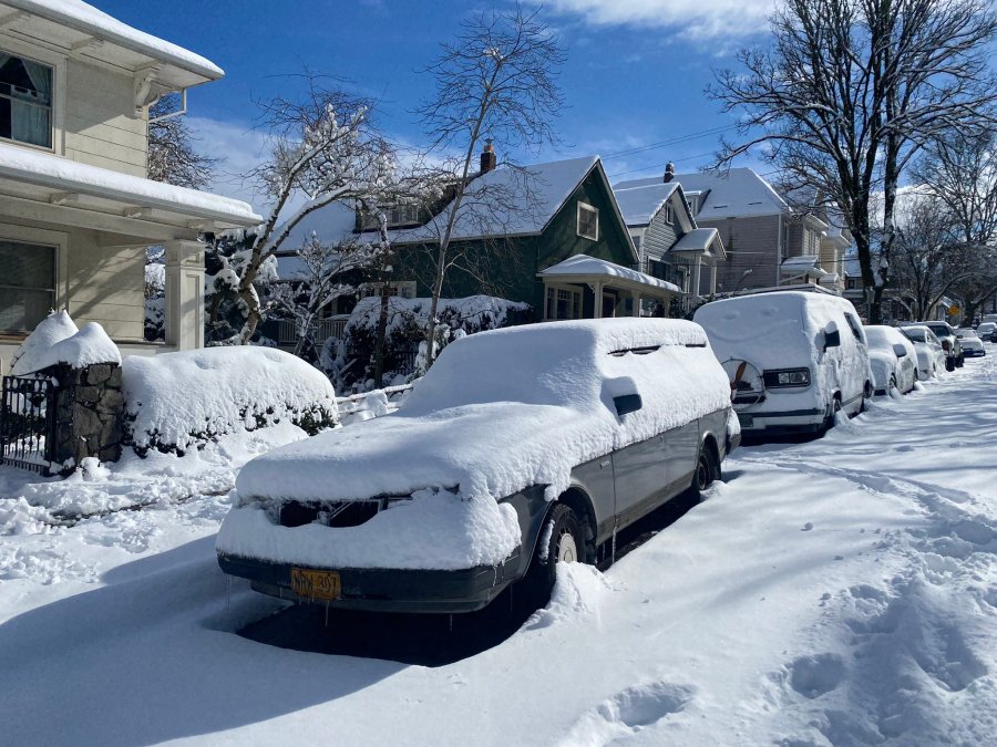 Snow blankets streets and parked vehicles in South Portland on Thursday, Feb. 23, 2023