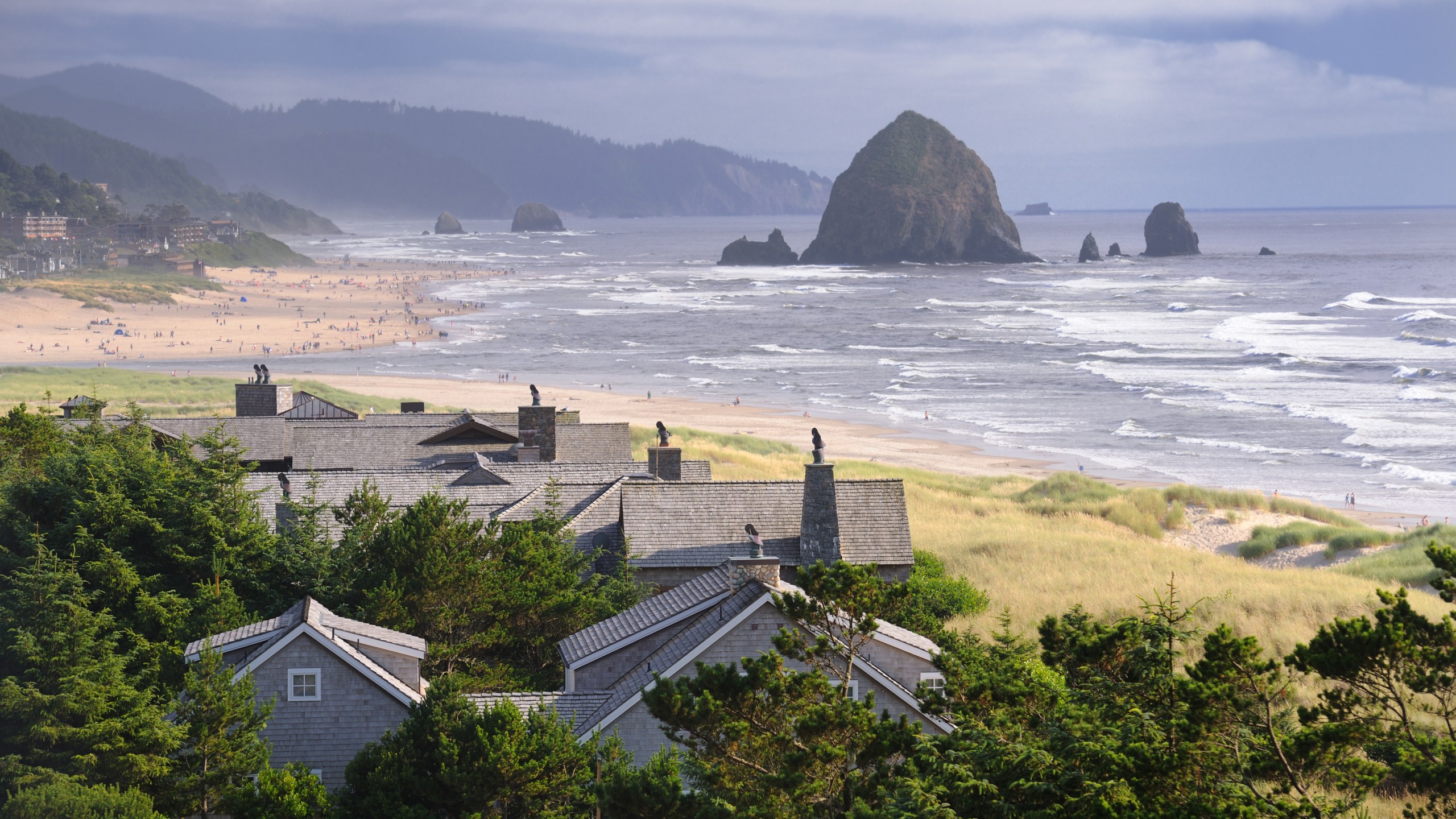 Haystack Rock seen in the distance in Cannon Beach, Oregon. (Credit: Getty Images)