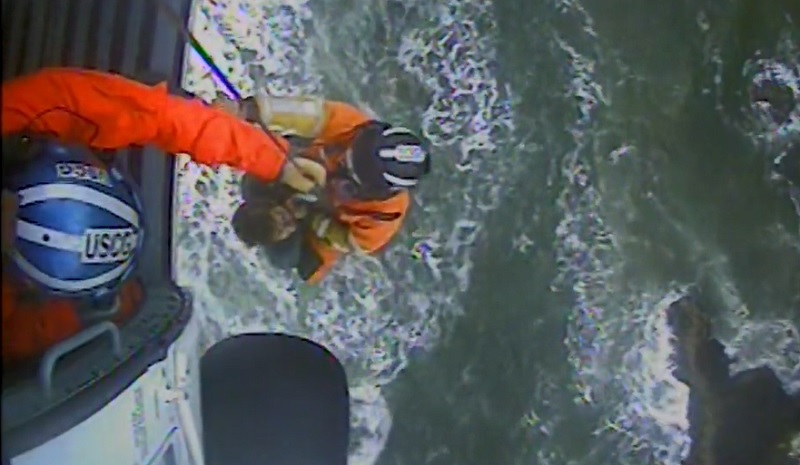 Two surfers were airlifted to safety by the US Coast Guard after becoming stranded on rocks near Ecola State Park, March 5, 2023 (US Coast Guard)