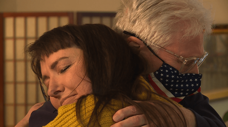 A tenant at Woodspring Apartments in Tigard hugs tenant advocate Margot Black, March 13, 2023 (KOIN)