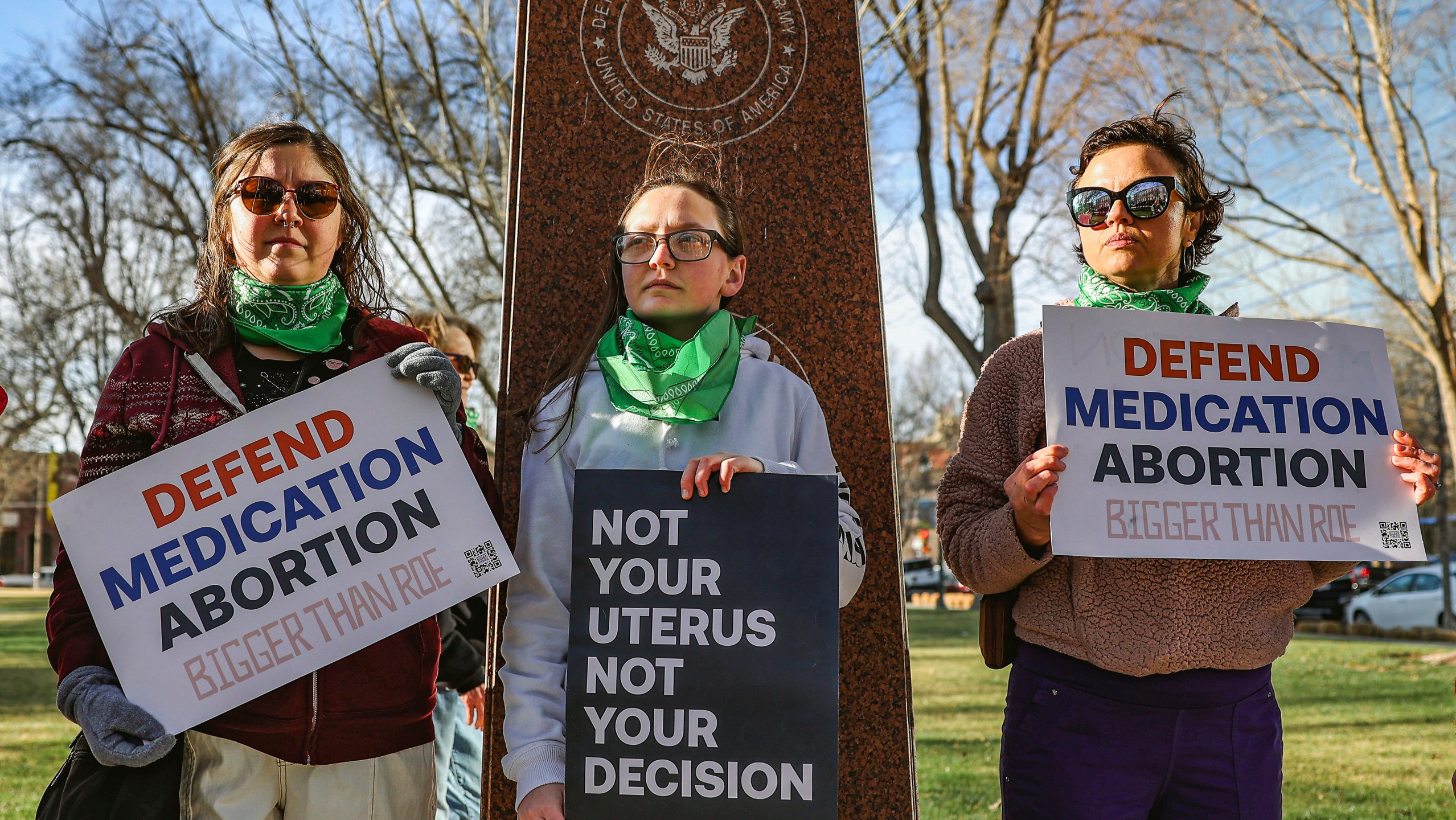 FILE - Three members of the Women's March group protest in support of access to abortion medication outside the Federal Courthouse on Wednesday, March 15, 2023 in Amarillo, Texas. Matthew Kacsmaryk, a Texas judge who sparked a legal firestorm with an unprecedented ruling halting approval of the nation's most common method of abortion, Friday, April 7, 2023, is a former attorney for a religious liberty legal group with a long history pushing conservative causes. (AP Photo/David Erickson)