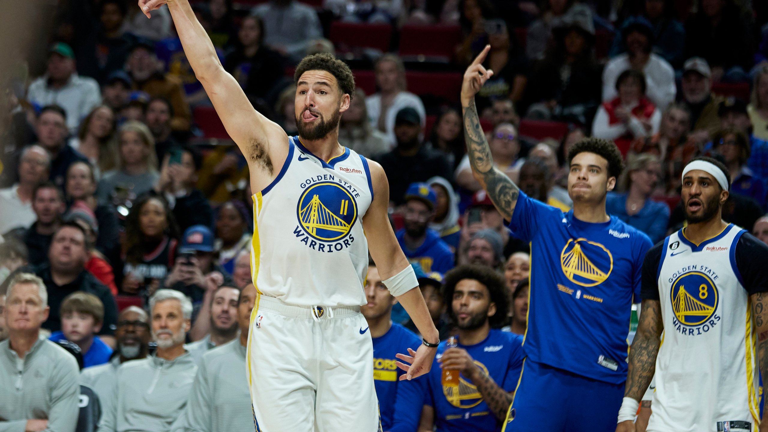 Golden State Warriors guard Klay Thompson reacts after making a 3-point basket against the Portland Trail Blazers during the second half of an NBA basketball game in Portland, Ore., Sunday, April 9, 2023. (AP Photo/Craig Mitchelldyer)