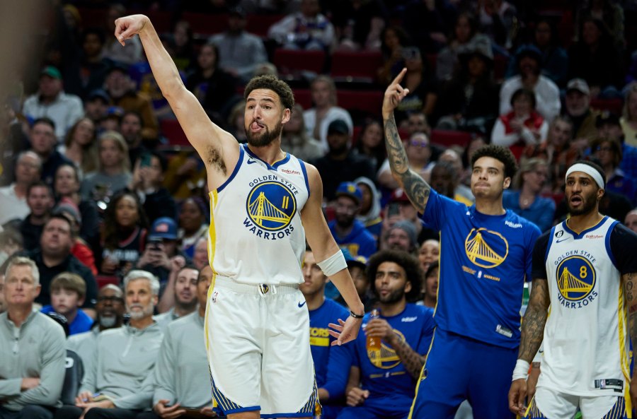 Golden State Warriors guard Klay Thompson reacts after making a 3-point basket against the Portland Trail Blazers during the second half of an NBA basketball game in Portland, Ore., Sunday, April 9, 2023. (AP Photo/Craig Mitchelldyer)