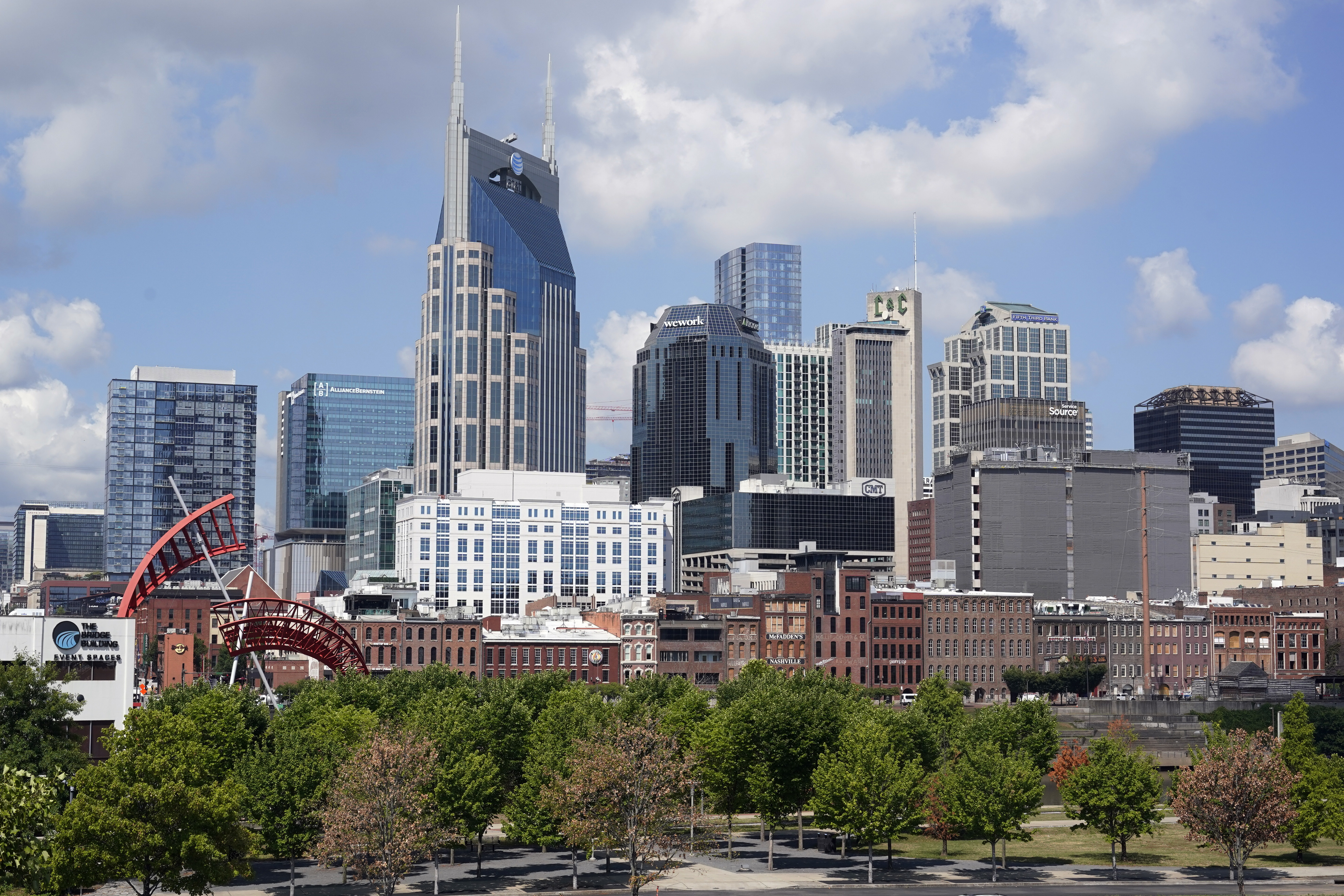 FILE - The Nashville, Tenn., skyline is shown July 11, 2022. Nashville officials on Monday, March 13, 2023, sued over a new Tennessee law that will cut the Democratic-leaning city's metro council in half, a move that follows the council’s rejection of efforts to host the 2024 Republican National Convention in Music City. (AP Photo/Mark Humphrey, File)