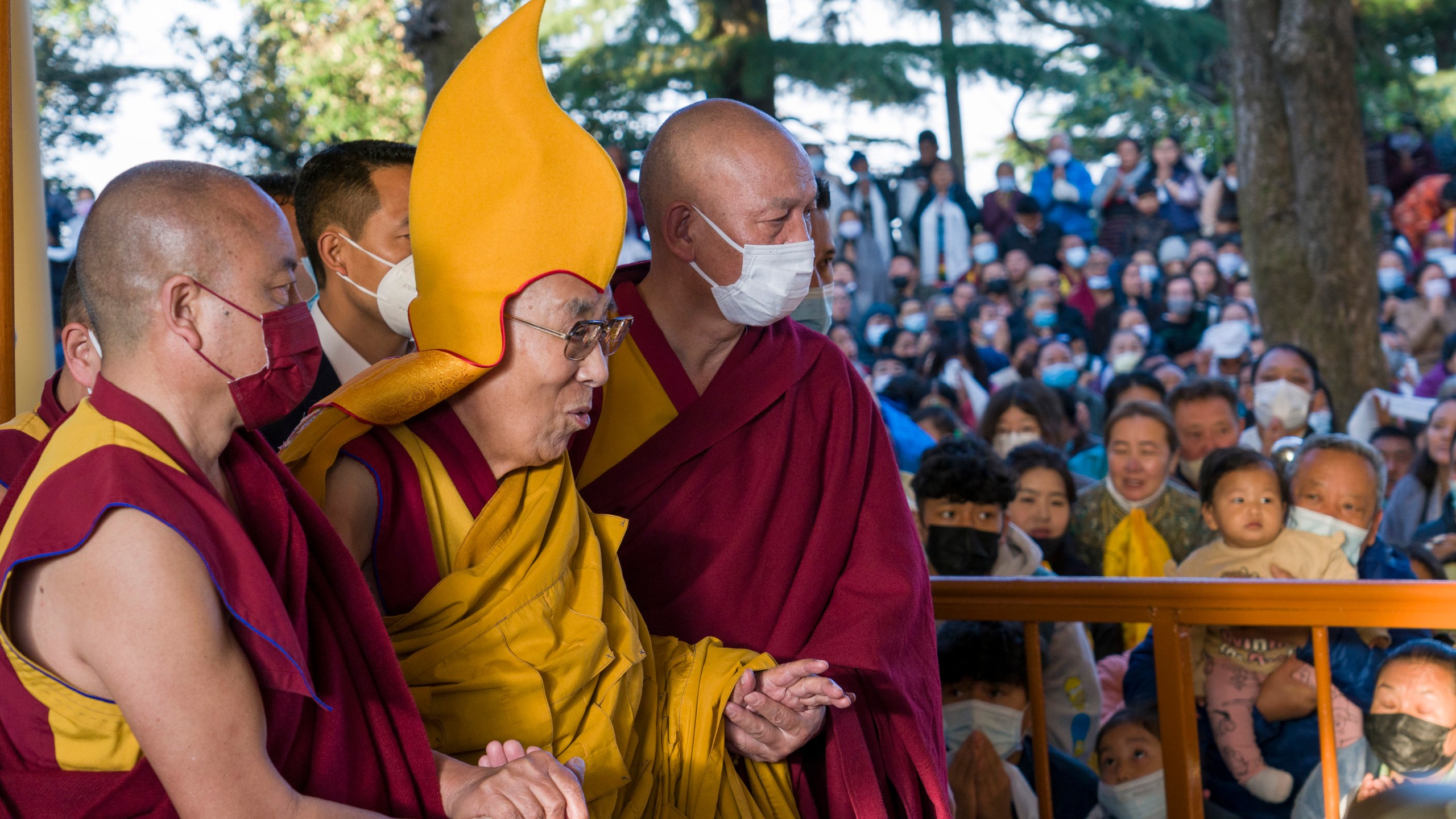 Tibetan spiritual leader the Dalai Lama in a ceremonial yellow hat arrives at the Tsuglakhang temple to give a sermon in Dharamsala, India, Tuesday, March 7, 2023. The Dalai Lama apologized Monday, April 10, after a video showing him kissing a child on the lips at a public gathering in February provoked outrage. (AP Photo/Ashwini Bhatia, File)