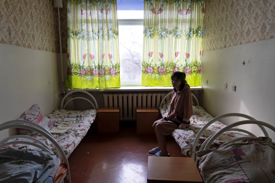 Natalia, 37, a patient, sits in her room at a psychiatric hospital in Kramatorsk, Ukraine, Tuesday March 21, 2023. In December, the World Health Organization said one in five people in countries that have experienced conflict in the past decade will suffer from a mental health condition, and estimated that about 9.6 million people in Ukraine could be affected. Russia’s invasion in February 2022 resulted in millions of people being displaced, bereaved, forced into basements for months due to incessant shelling or enduring harrowing journeys from Russian-occupied regions. (AP Photo/Vasilisa Stepanenko)