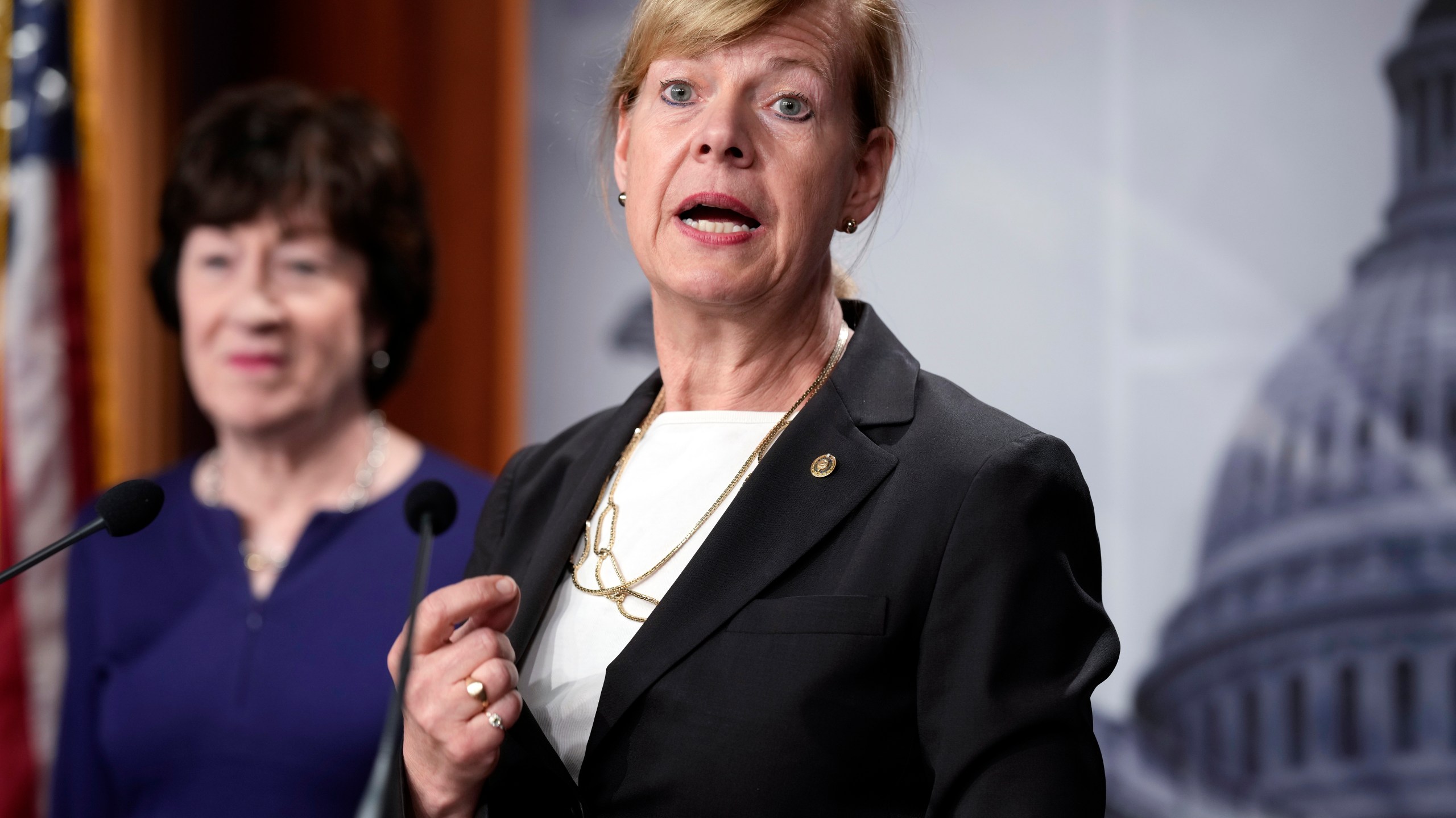 FILE - Sen. Tammy Baldwin, D-Wis., joined at left by Sen. Susan Collins, R-Maine, speaks to reporters following Senate passage of the Respect for Marriage Act, at the Capitol in Washington, Nov. 29, 2022. Baldwin is seeking a third term in battleground Wisconsin. Baldwin says in a statement released Wednesday, April 12, 2023, she'll continue to fight for the working class and families struggling with inflation and to oppose Wisconsin's abortion ban.(AP Photo/J. Scott Applewhite, File)