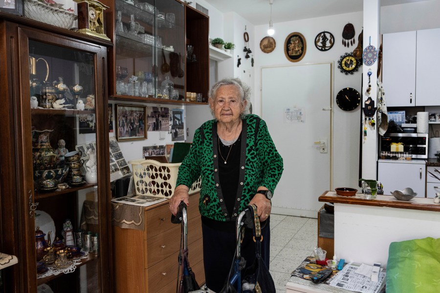 Holocaust survivor Tova Gutstein, 90, who lived in the Warsaw Ghetto as a child, poses for a photo at her apartment in the city of Rishon Lezion, Israel, Sunday, April 9, 2023. Gutstein was a child when the Nazis put down the Warsaw Ghetto Uprising. Now 90, she is one of the few remaining survivors who witnessed that act of Jewish resistance against Nazi Germany as Israel marks the revolt's 80th anniversary on Holocaust Memorial Day. (AP Photo/Tsafrir Abayov)