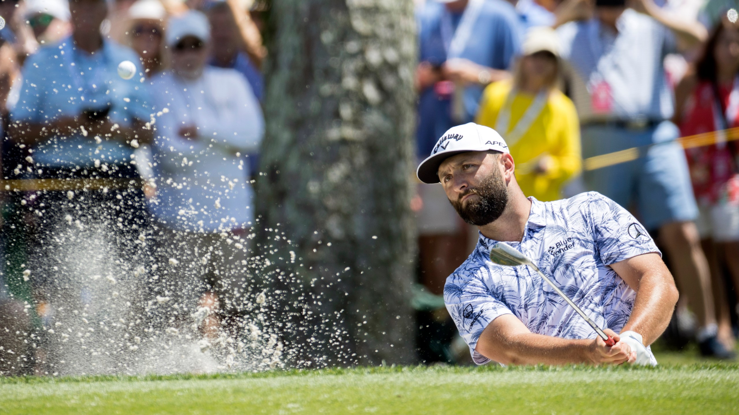 Jon Rahm, of Spain, hits out of a bunker on the ninth green during the second round of the RBC Heritage golf tournament, Friday, April 14, 2023, in Hilton Head Island, S.C. (AP Photo/Stephen B. Morton)