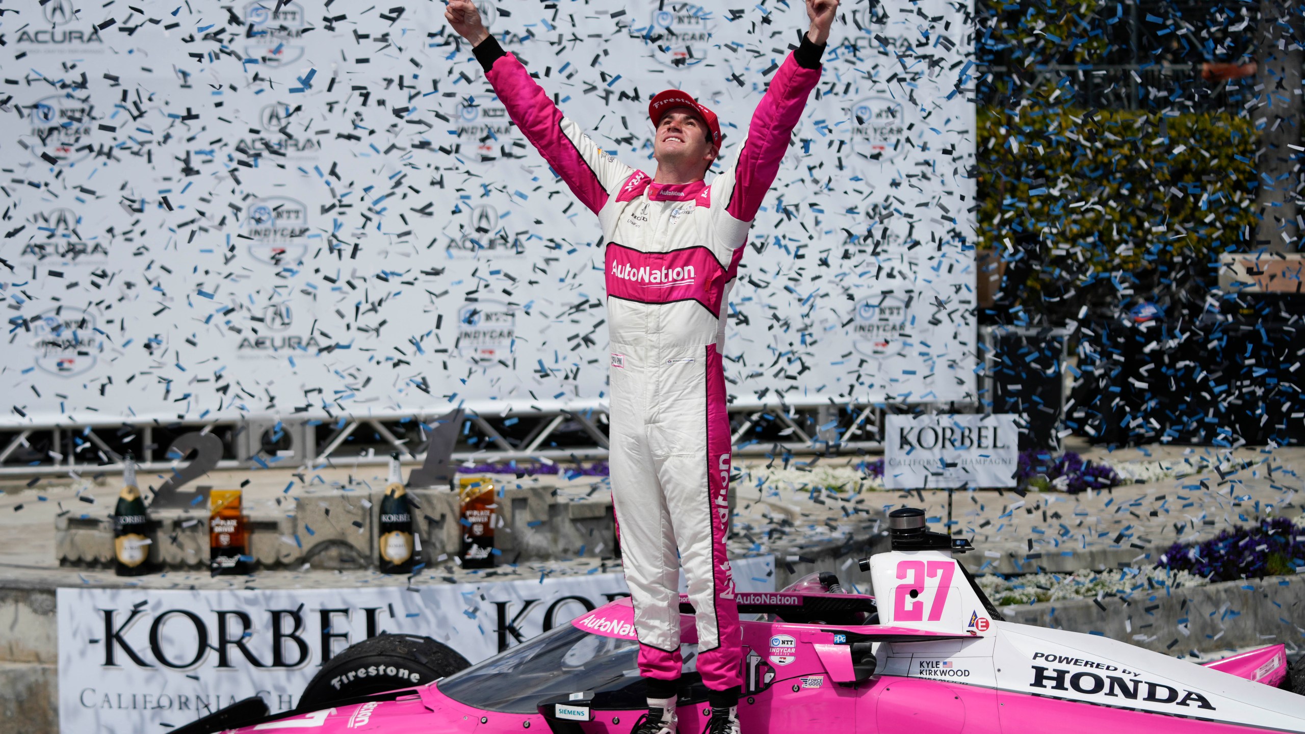 Kyle Kirkwood celebrates during the victory ceremony after winning the IndyCar Grand Prix of Long Beach auto race, Sunday, April 16, 2023, in Long Beach, Calif. (AP Photo/Jae C. Hong)