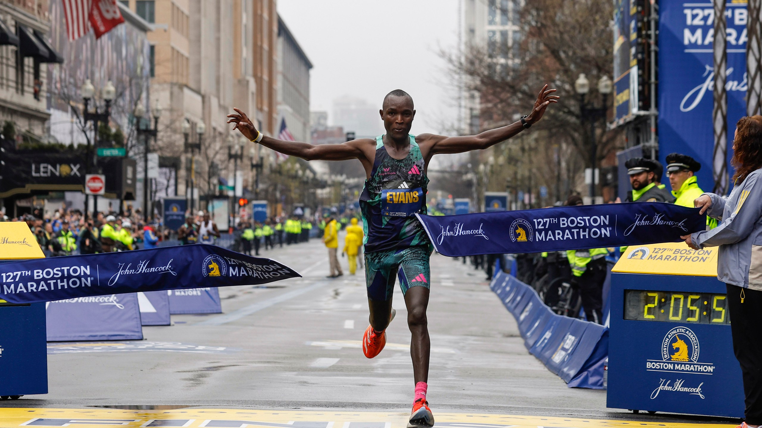 Evans Chebet of Kenya breaks the tape to win the 127th Boston Marathon, Monday, April 17, 2023, in Boston. (AP Photo/Winslow Townson)