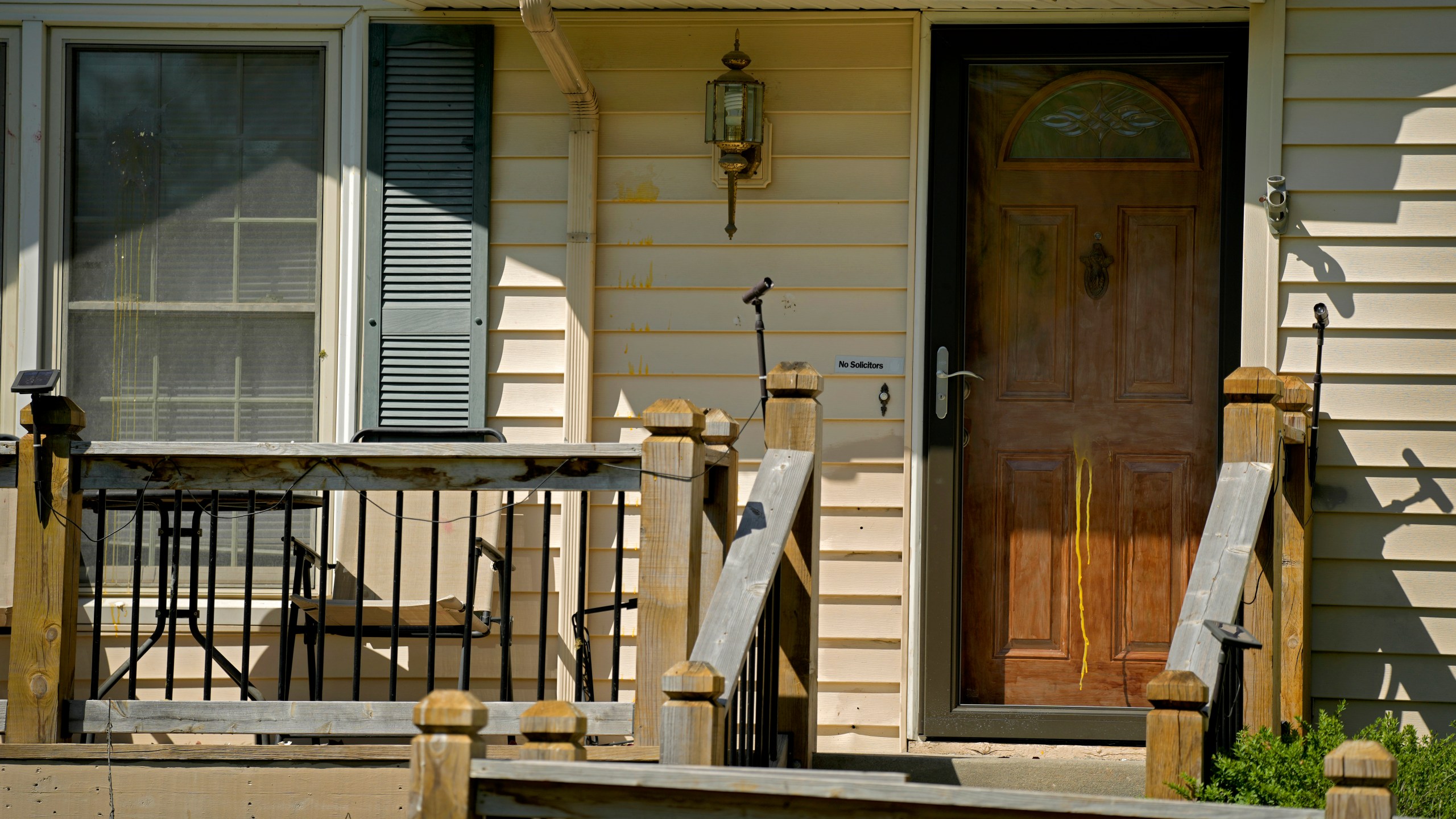 Dried egg is seen on the front of a house, Monday, April 17, 2023, where 16-year-old Ralph Yarl was shot Thursday after he went to the wrong address to pick up his younger brothers in Kansas City, Mo. (AP Photo/Charlie Riedel)