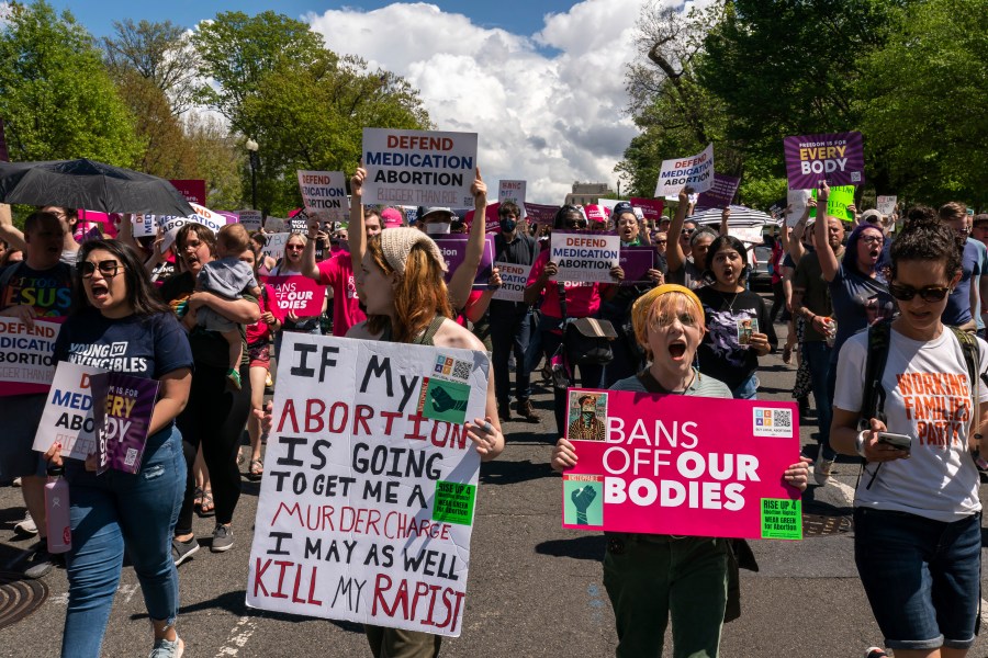 Protesters march past the U.S. Capitol following a Planned Parenthood rally in support of abortion access outside the Supreme Court on Saturday, April. 15, 2023, in Washington. (AP Photo/Nathan Howard)