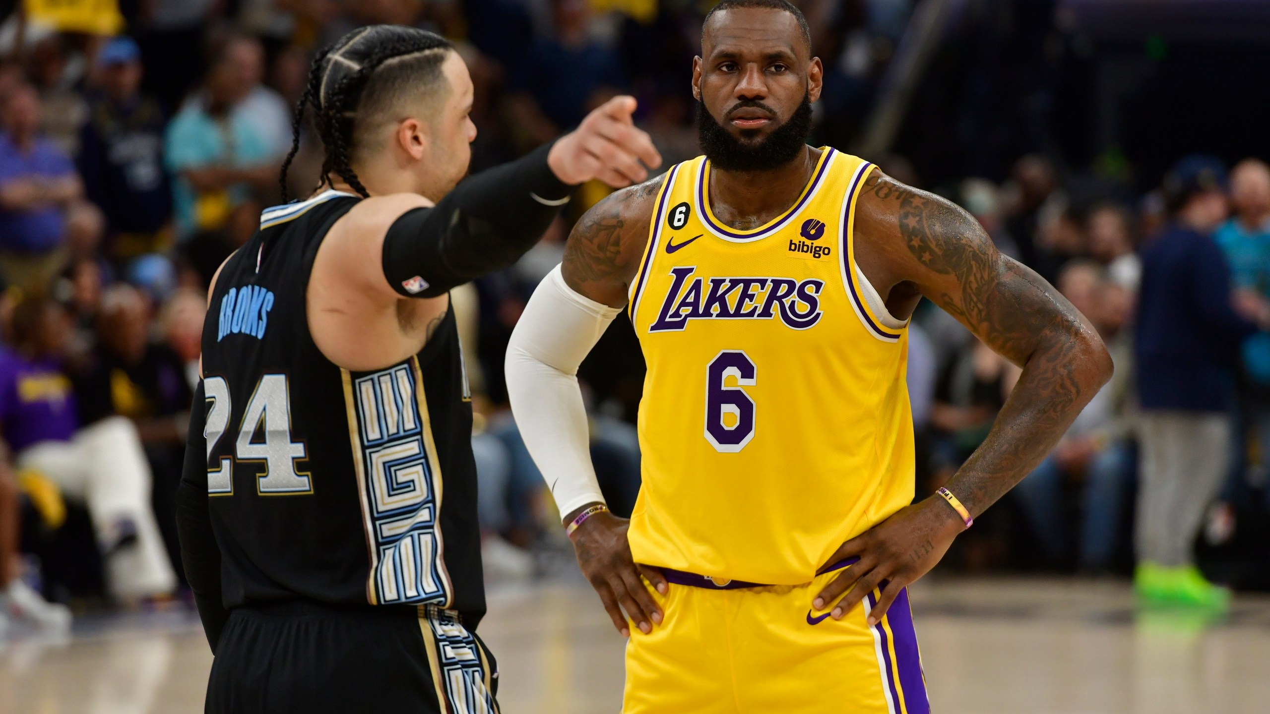 Memphis Grizzlies forward Dillon Brooks (24) talks to Los Angeles Lakers forward LeBron James (6) during the second half of Game 2 in a first-round NBA basketball playoff series Wednesday, April 19, 2023, in Memphis, Tenn. (AP Photo/Brandon Dill)