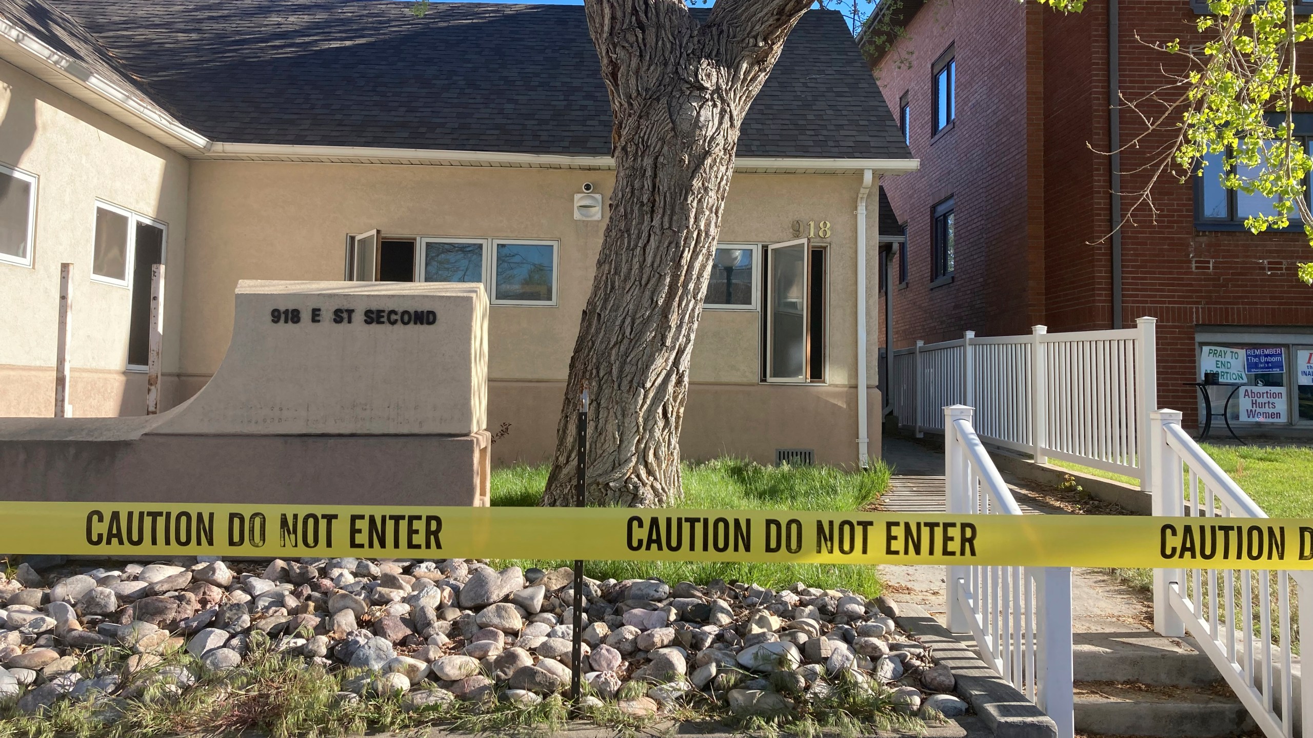 FILE - The fire-damaged Wellspring Health Access clinic is cordoned by tape on May 25, 2022, in in Casper, Wyo. Wyoming’s first full-service abortion clinic in years defiantly opened Thursday, April, 20, 2023, nearly one year after an arson attack ravaged it and despite looming laws that could shut it down with some of the toughest abortion restrictions in the U.S. (AP Photo/Mead Gruver, File)