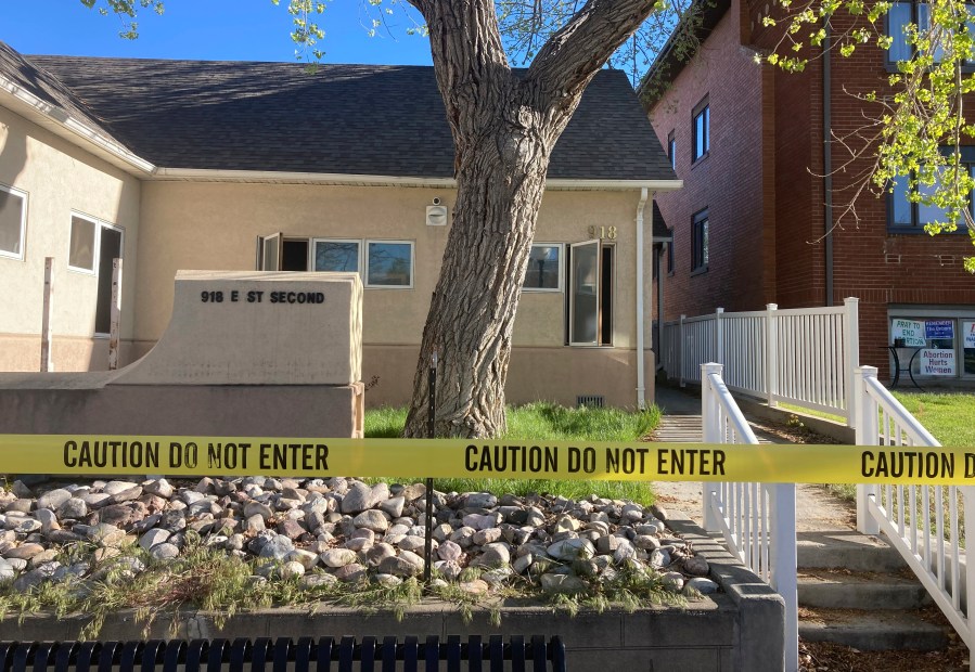 FILE - The fire-damaged Wellspring Health Access clinic is cordoned by tape on May 25, 2022, in in Casper, Wyo. Wyoming’s first full-service abortion clinic in years defiantly opened Thursday, April, 20, 2023, nearly one year after an arson attack ravaged it and despite looming laws that could shut it down with some of the toughest abortion restrictions in the U.S. (AP Photo/Mead Gruver, File)