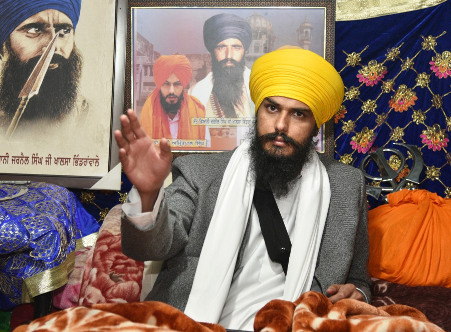 Sikh separatist leader and head of Waris Punjab De, or Punjab's Heirs, Amritpal Singh, talks to his supporters in the village Jallupur Khera, near Amritsar, India, Saturday, Jan.7, 2023. Indian police on Sunday April 23, arrested a Sikh separatist leader who has revived calls for secession of India's northern Punjab state bordering a hostile Pakistan, the police said. (AP Photo/Prabhjot Gill)