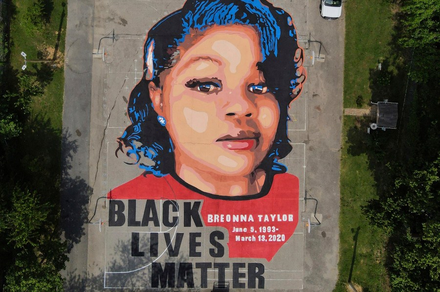 FILE - A ground mural depicting a portrait of Breonna Taylor is seen at Chambers Park in Annapolis, Md., July 6, 2020. The former Louisville Metro Police officer who fatally shot Breonna Taylor has a new job in law enforcement. WHAS-TV reported that the Carroll County Sheriff’s Office confirmed Saturday, April 24, 2023, the hiring of Myles Cosgrove who was fired from the police department in January 2021 for violating use-of-force procedures and failing to use a body camera during the raid on Taylor’s apartment. (AP Photo/Julio Cortez, File)