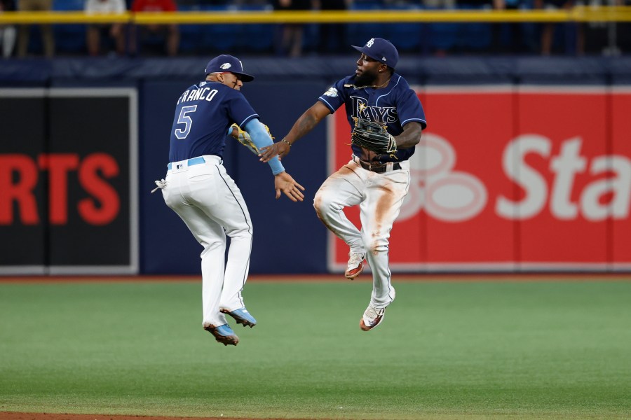 Tampa Bay Rays' Wander Franco, left, and Randy Arozarena celebrate after the Rays defeated the Boston Red Sox in a baseball game Tuesday, April 11, 2023, in St. Petersburg, Fla. (AP Photo/Scott Audette)