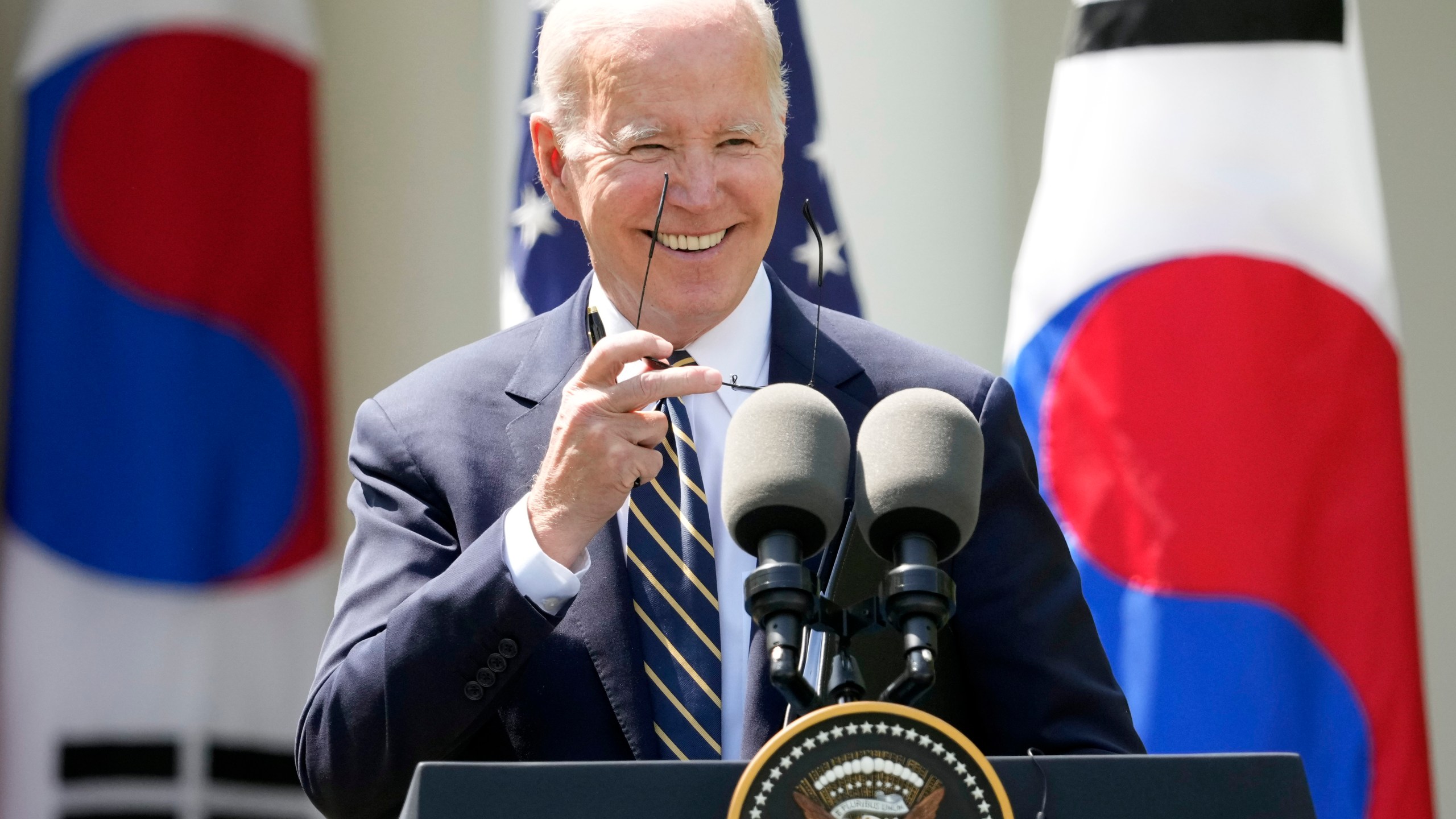 President Joe Biden takes his sunglasses off at a news conference with South Korea's President Yoon Suk Yeol in the Rose Garden of the White House Wednesday, April 26, 2023, in Washington. (AP Photo/Andrew Harnik)