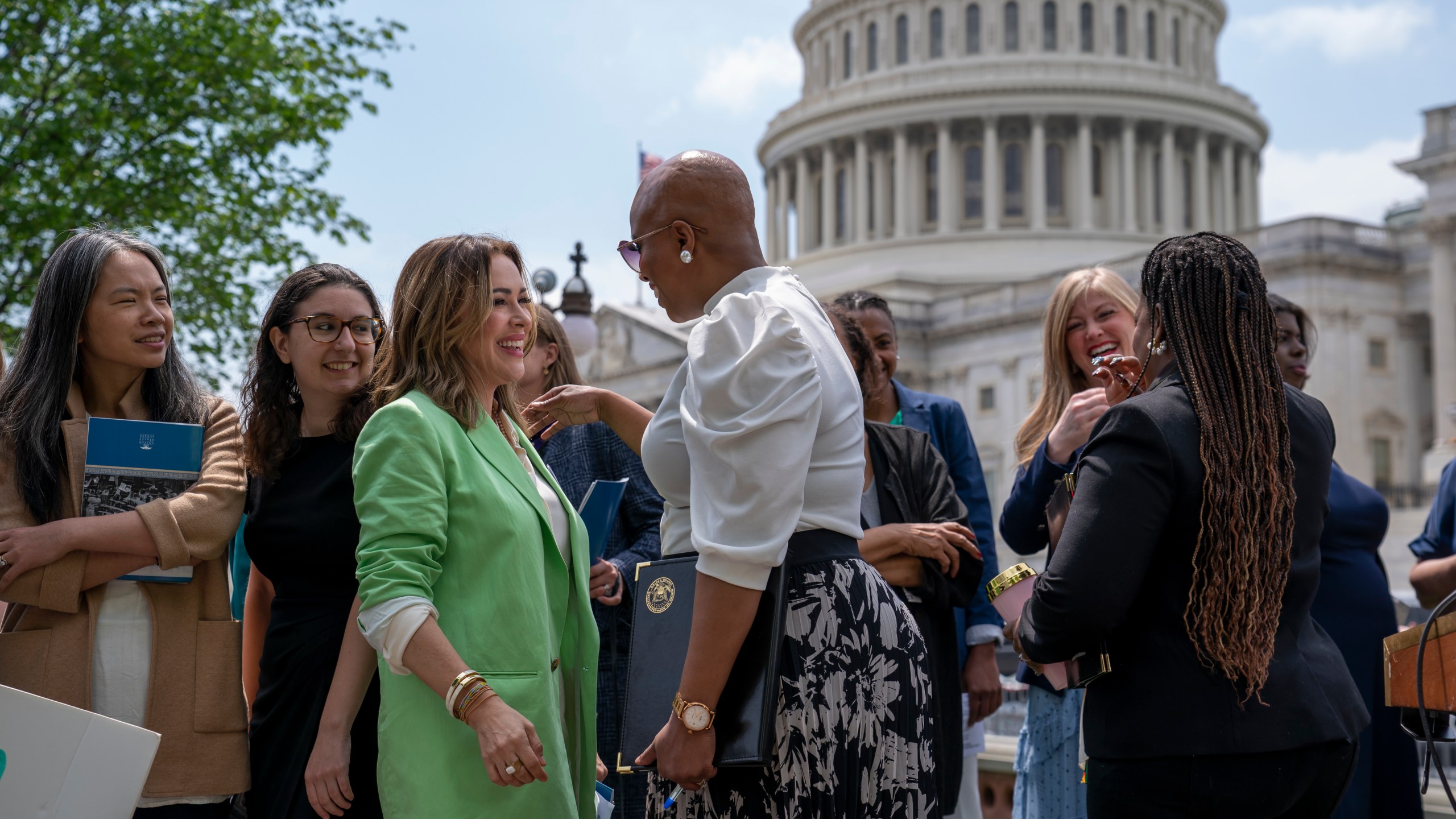 Activist Alyssa Milano, left, is greeted by Rep. Ayanna Pressley, D-Mass., center, as they arrive to tell reporters they want to remove the deadline for ratification of the Equal Rights Amendment, during a news conference at the Capitol in Washington, Thursday, April 27, 2023. Senate Republicans on Thursday blocked a Democratic measure to revive the Equal Rights Amendment. (AP Photo/J. Scott Applewhite)