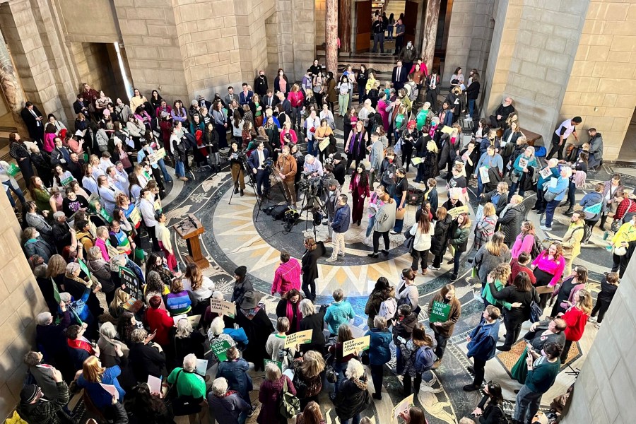 FILE - Hundreds of people crowded the Nebraska State Capitol Rotunda on Wednesday, Feb. 1, 2023, in Lincoln. Neb., to protest a so-called heartbeat bill that would outlaw abortion at a point before many women even know they're pregnant. North Dakota adopted a new abortion ban, while South Carolina and Nebraska lawmakers failed to and Washington and Minnesota protected abortion access. (AP Photo/Margery A. Beck, File)