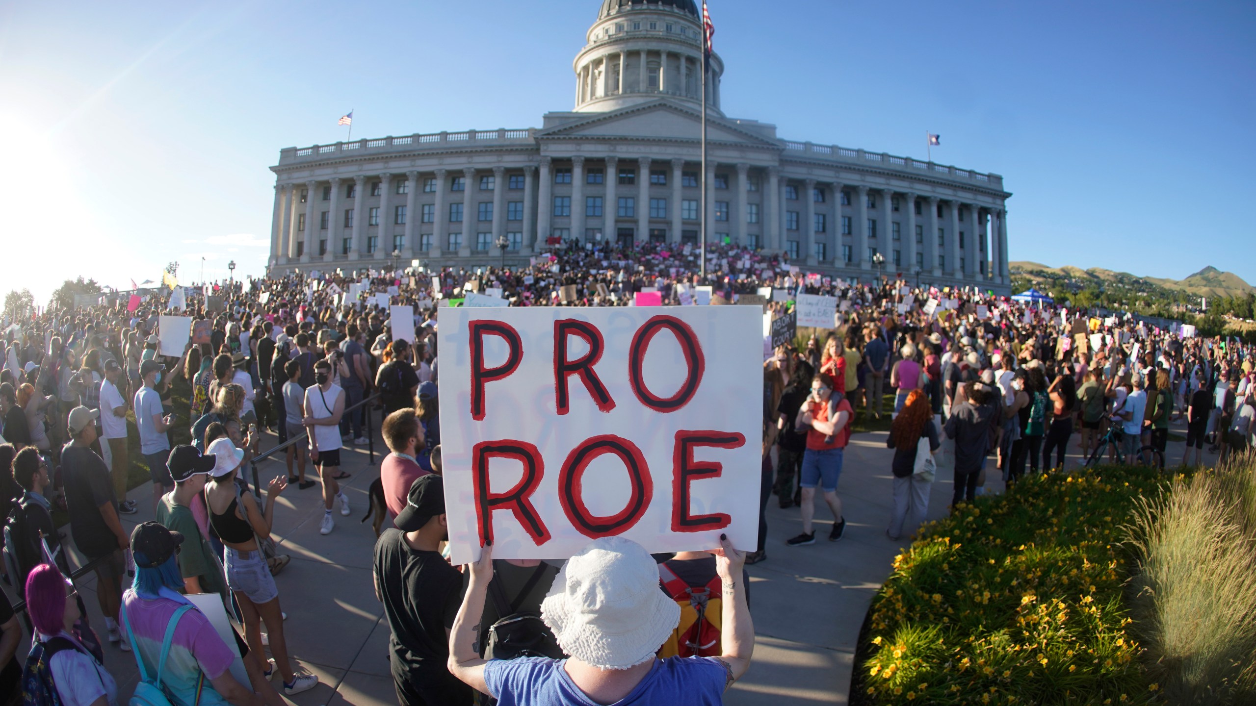 FILE - People attend an abortion-rights rally at the Utah State Capitol in Salt Lake City after the U.S. Supreme Court overturned Roe v. Wade, June 24, 2022. A Utah court on Friday, April 28, 2023, will consider a request from Planned Parenthood to delay implementing a statewide ban on abortion clinics set to begin taking effect next week. The organization in a motion filed earlier this month argued a state law passed earlier this year will severely curtail access to abortion in Utah. (AP Photo/Rick Bowmer, File)