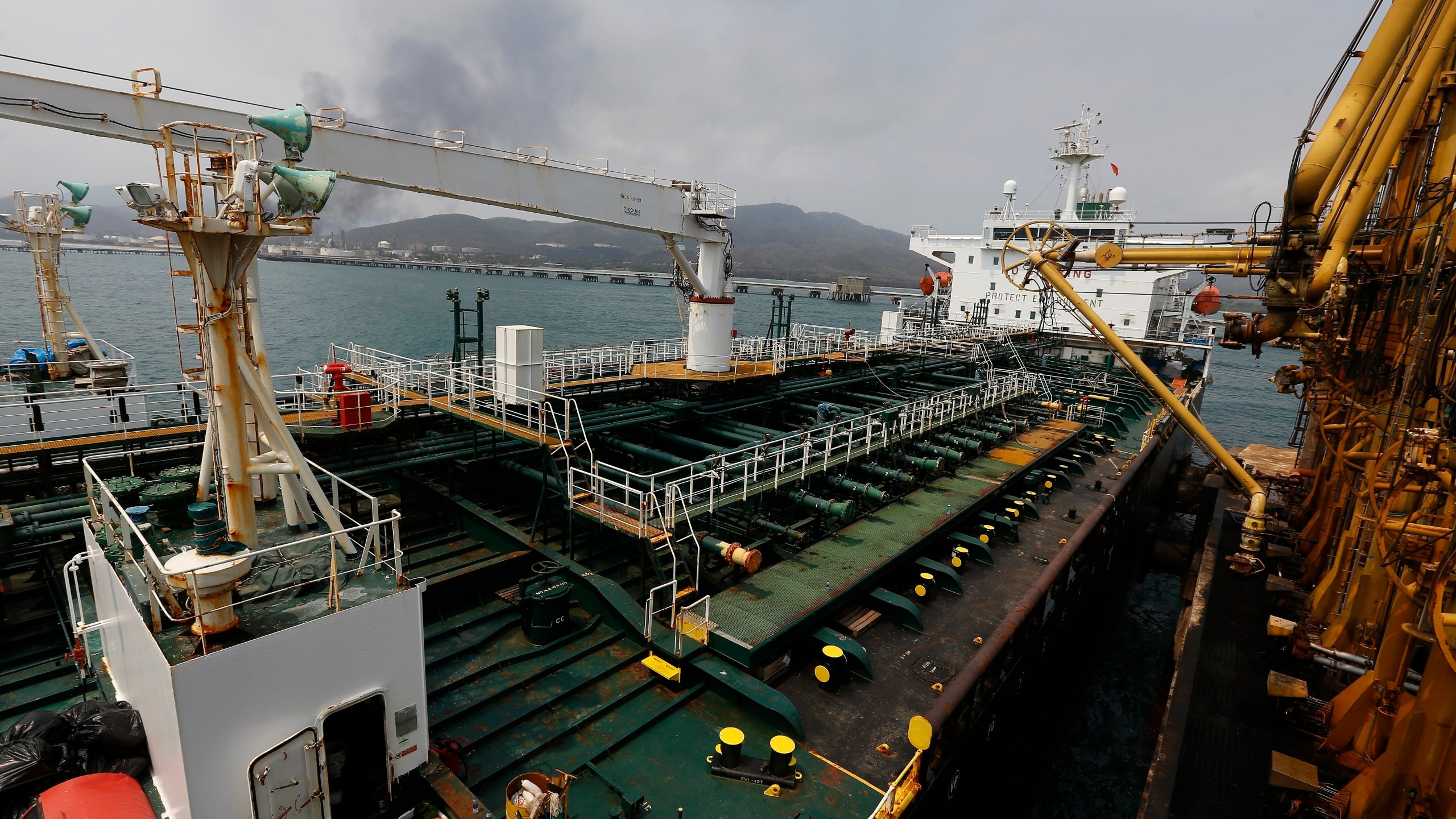 FILE - Iranian oil tanker Fortune is anchored at the dock of the El Palito refinery near Puerto Cabello, Venezuela, May 25, 2020. A dozen senators are making a bipartisan appeal to President Joe Biden to reinvigorate the power of U.S. authorities to seize Iranian oil assets under an enforcement program they say has been allowed to languish. Despite existing sanctions, Iranian oil exports jumped 35% last year and proceeds are being used to sponsor attacks on U.S. citizens and servicemembers as well as allies, the senators said in a letter to the president. (AP Photo/Ernesto Vargas, File)