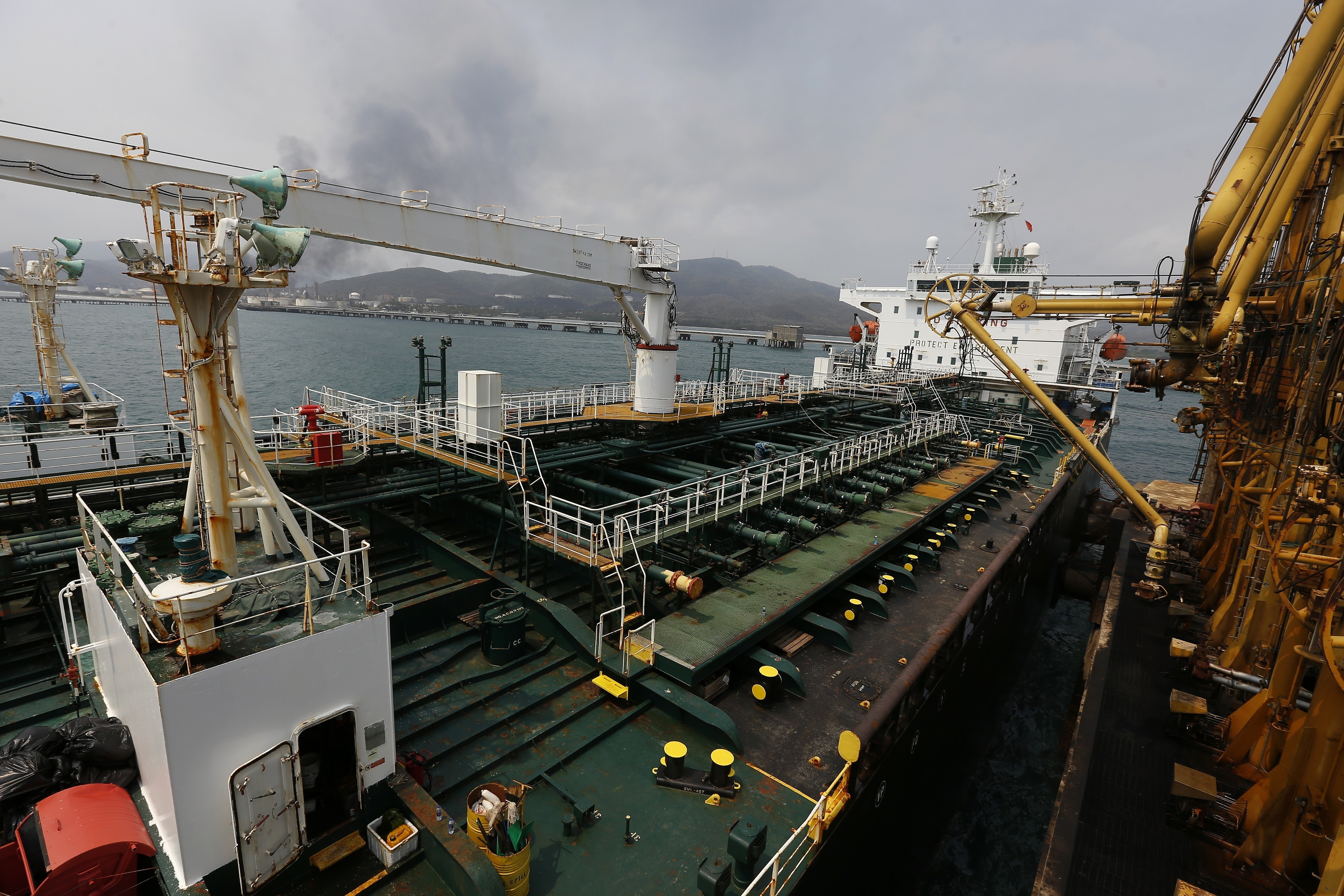 FILE - Iranian oil tanker Fortune is anchored at the dock of the El Palito refinery near Puerto Cabello, Venezuela, May 25, 2020. A dozen senators are making a bipartisan appeal to President Joe Biden to reinvigorate the power of U.S. authorities to seize Iranian oil assets under an enforcement program they say has been allowed to languish. Despite existing sanctions, Iranian oil exports jumped 35% last year and proceeds are being used to sponsor attacks on U.S. citizens and servicemembers as well as allies, the senators said in a letter to the president. (AP Photo/Ernesto Vargas, File)