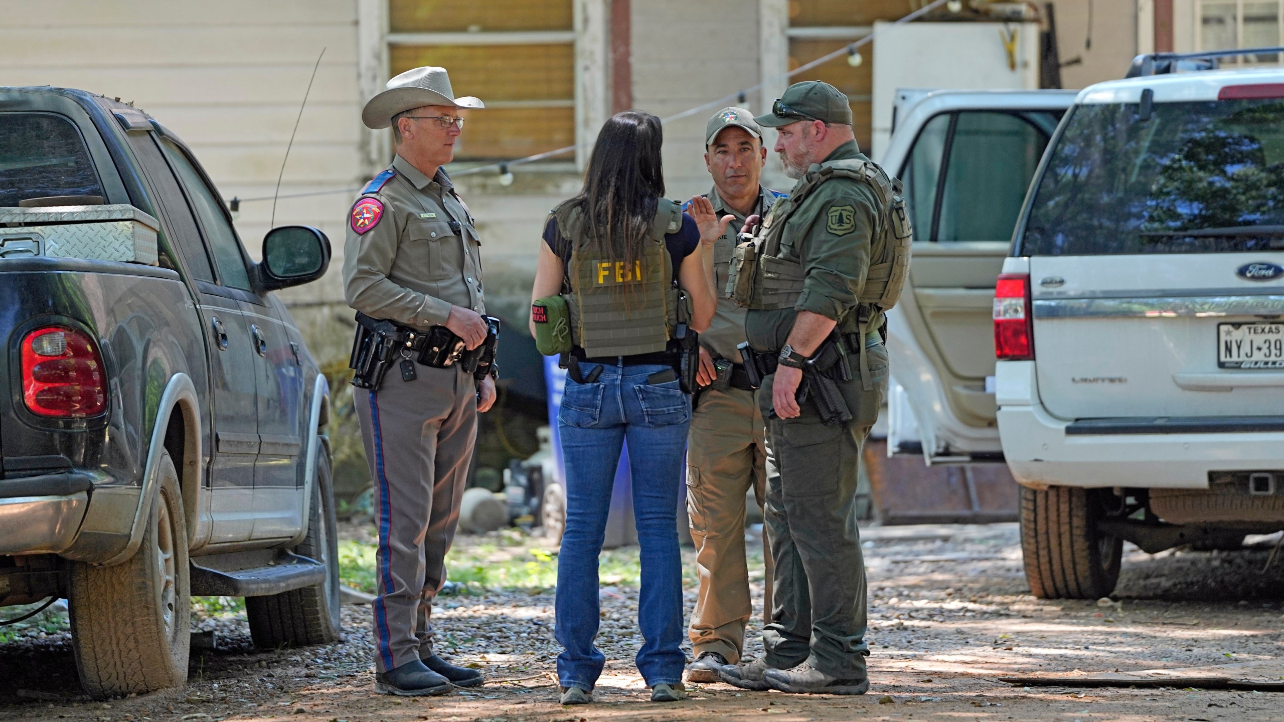 Law enforcement officials work Sunday, April 30, 2023, in the neighborhood where a mass shooting occurred Friday night, in Cleveland, Texas. The search for a Texas man who allegedly shot his neighbors after they asked him to stop firing off rounds in his yard stretched into a second day Sunday, with authorities saying the man could be anywhere by now. Francisco Oropeza, 38, fled after the shooting Friday night that left several people dead, including a young boy. (AP Photo/David J. Phillip)