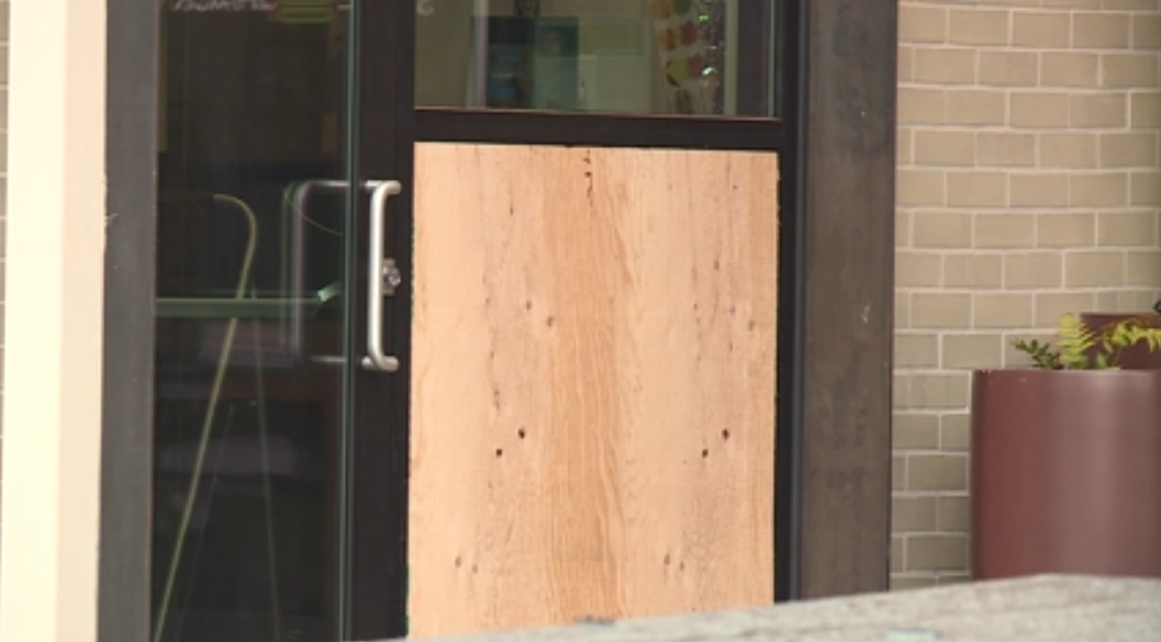 A window boarded up at the downtown Shake Shack location in Portland on Wednesday, April 19, 2023