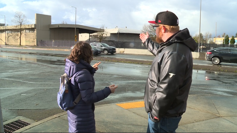 Gavin Bramley stands with KOIN 6 News reporter Elise Haas outside a proposed sanctioned campsite in Southeast Portland, April 3, 2023 (KOIN)