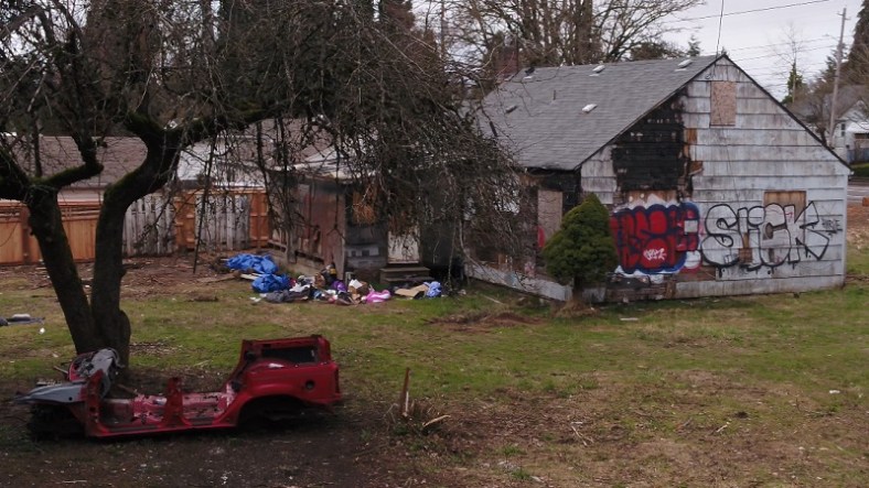 An abandoned house at SE 139th and East Burnside has been taken over by squatters in Portland, April 2023 (KOIN)