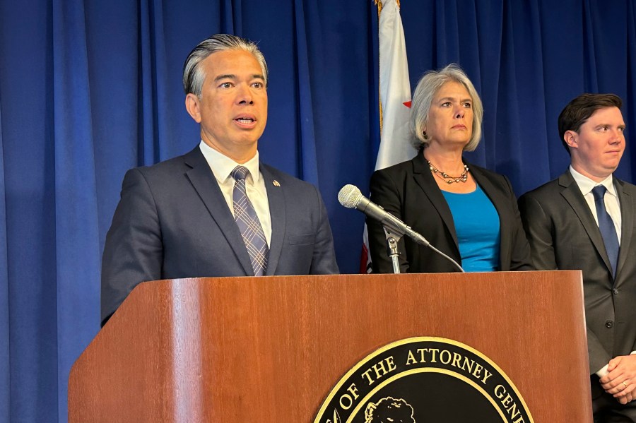 California Attorney General Rob Bonta, left, speaks during a news conference in Sacramento, Calif., on Monday, May 1, 2023. Bonta announced a lawsuit against the city of Elk Grove for not approving an apartment complex for people experiencing homelessness. (AP Photo/Adam Beam)