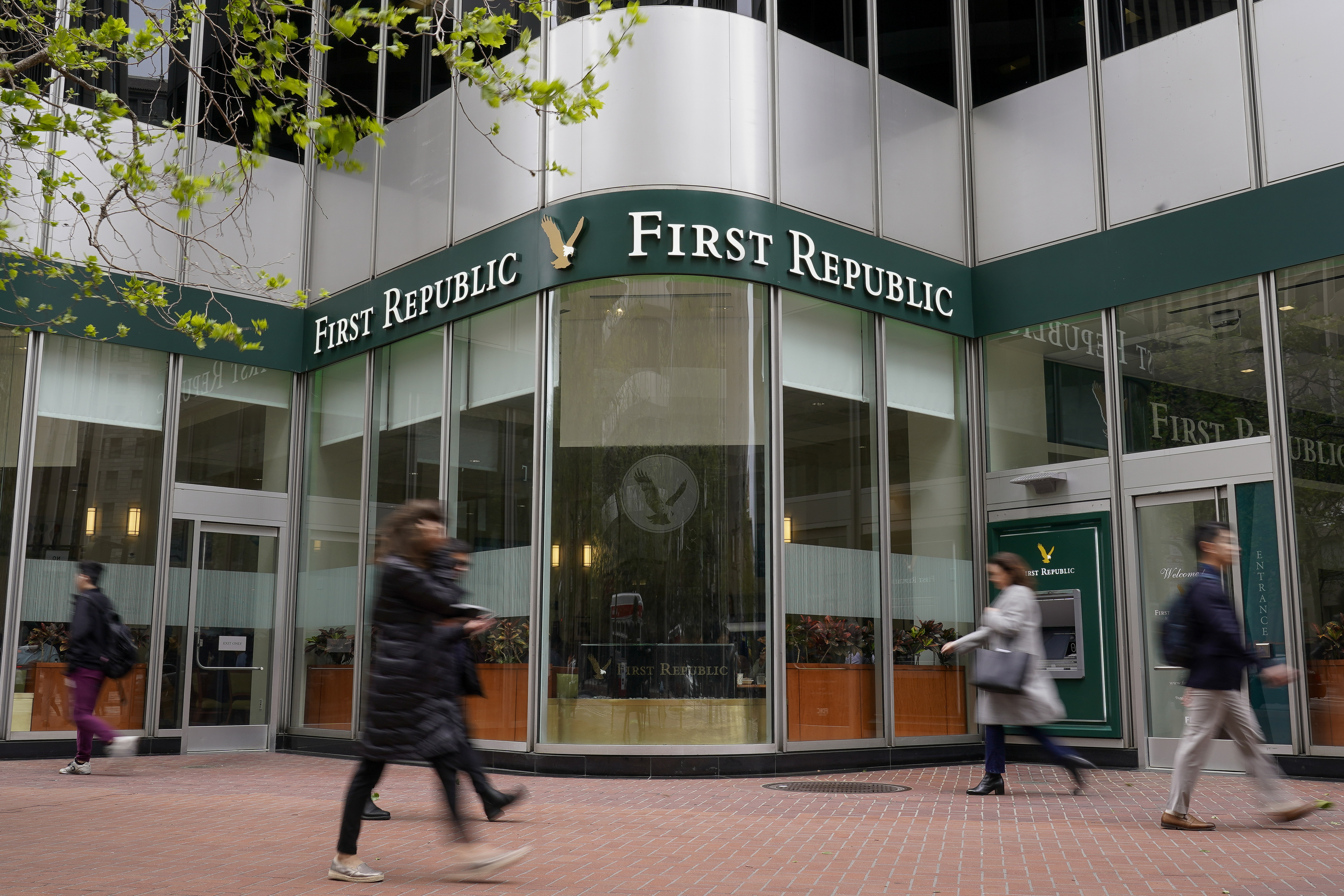 Pedestrians walk past the headquarters of First Republic Bank in San Francisco, Monday, May 1, 2023. Regulators seized the troubled bank early Monday, making it the second-largest bank failure in U.S. history, and promptly sold all of its deposits and most of its assets to JPMorgan Chase Bank in a bid to head off further banking turmoil in the U.S. (AP Photo/Godofredo A. Vásquez)