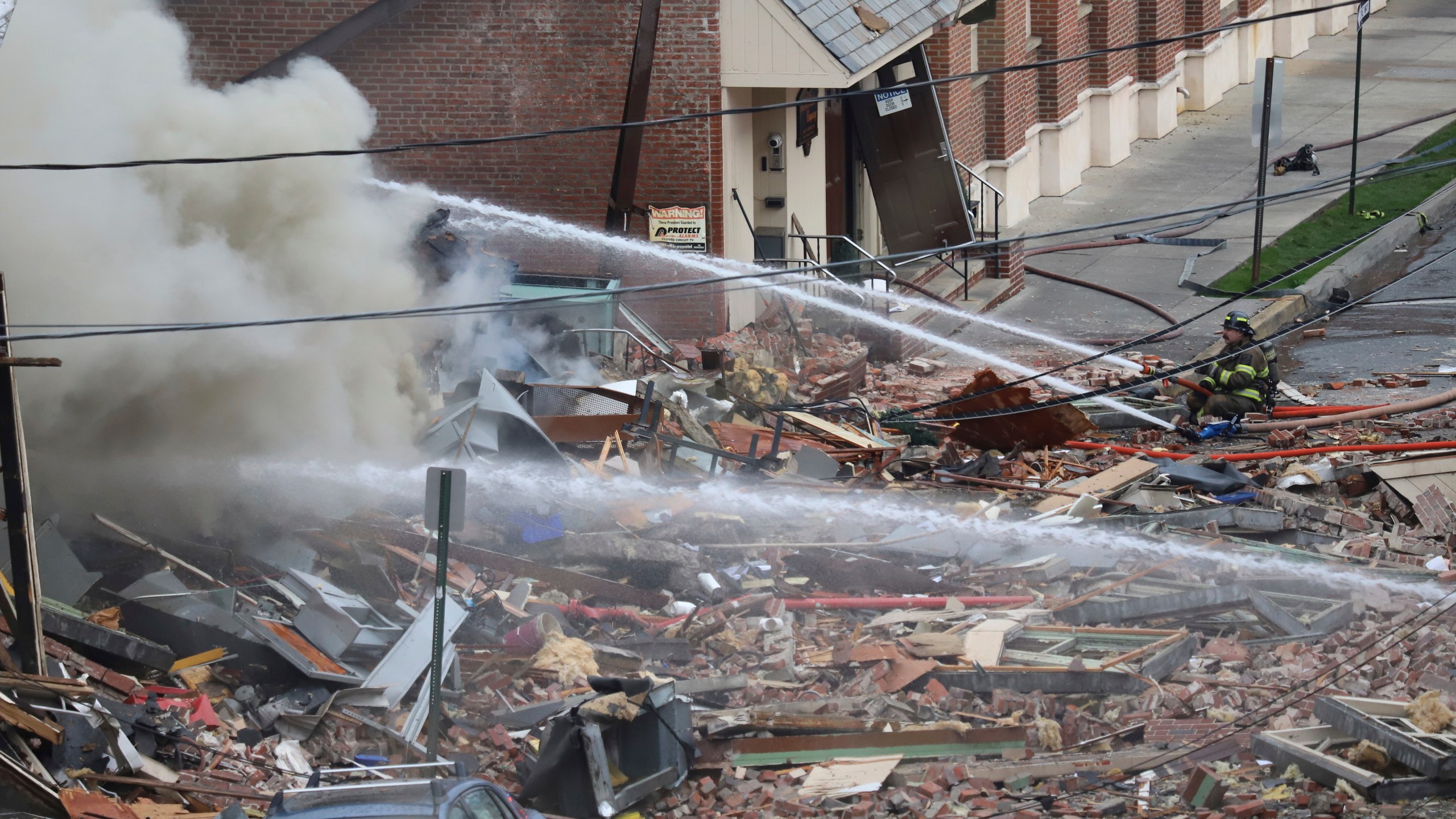 FILE - Emergency personnel work at the site of a deadly explosion at a chocolate factory in West Reading, Pa., March 24, 2023. Workers at the Pennsylvania chocolate factory smelled “rotten eggs" before a powerful natural gas explosion that leveled one building, heavily damaged another and killed seven, federal safety officials said Monday, May 2, in a preliminary report. (Jeff Doelp/Reading Eagle via AP, File)