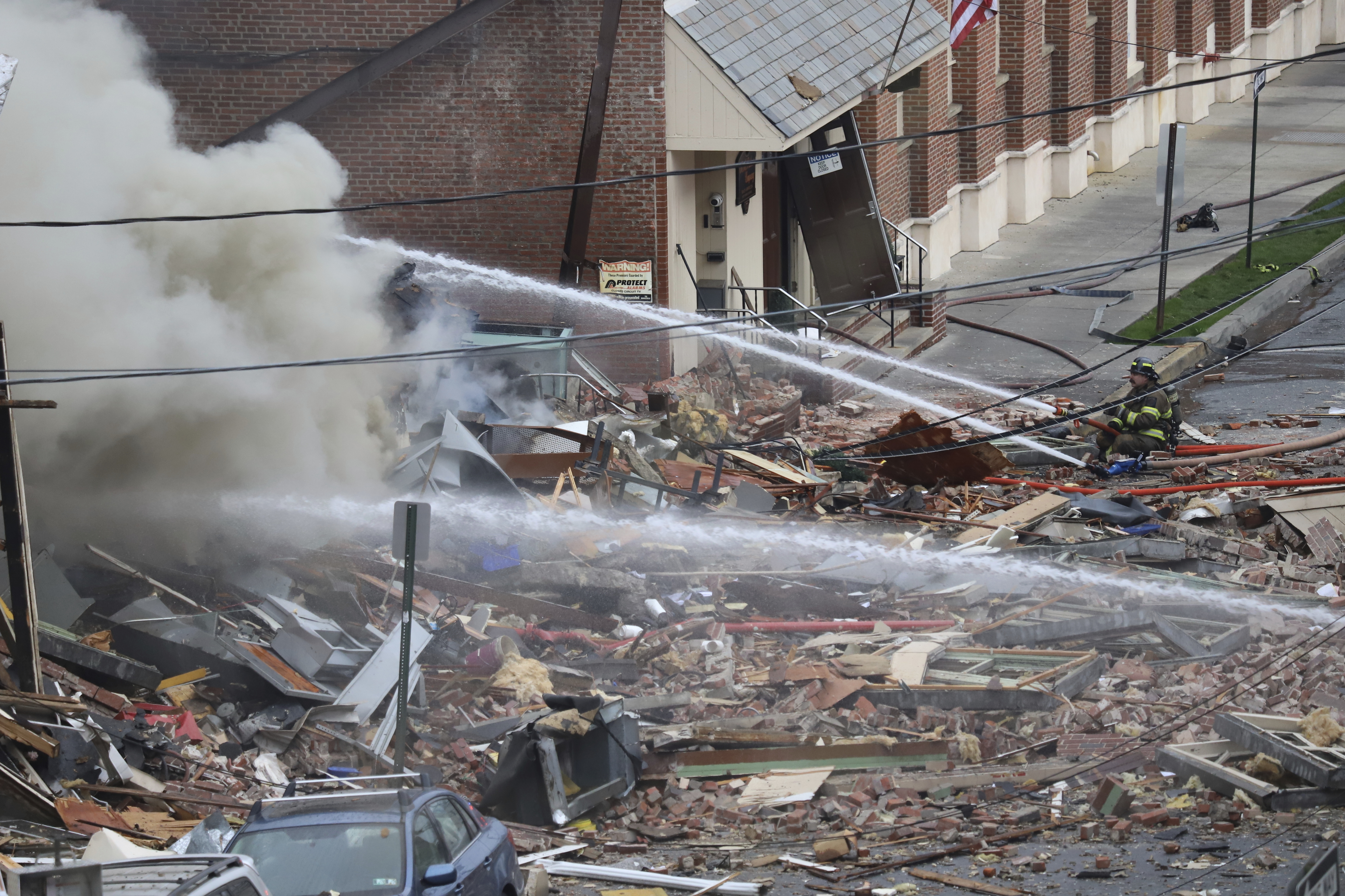 FILE - Emergency personnel work at the site of a deadly explosion at a chocolate factory in West Reading, Pa., March 24, 2023. Workers at the Pennsylvania chocolate factory smelled “rotten eggs" before a powerful natural gas explosion that leveled one building, heavily damaged another and killed seven, federal safety officials said Monday, May 2, in a preliminary report. (Jeff Doelp/Reading Eagle via AP, File)