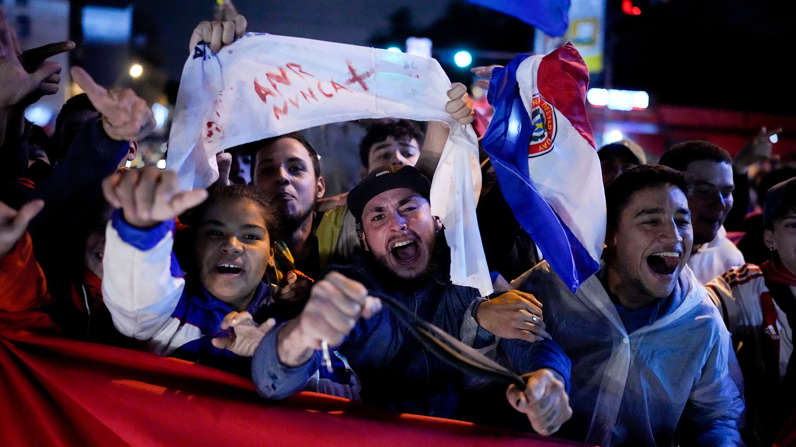 Demonstrators protest, claiming fraud in the general election, in Asuncion, Paraguay Tuesday, May 2, 2023. Paraguayans voted on Sunday to keep the long-ruling Colorado Party in power for five more years, backing its presidential candidate and giving it majorities in both houses of Congress. (AP Photo/Jorge Saenz)