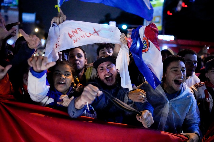 Demonstrators protest, claiming fraud in the general election, in Asuncion, Paraguay Tuesday, May 2, 2023. Paraguayans voted on Sunday to keep the long-ruling Colorado Party in power for five more years, backing its presidential candidate and giving it majorities in both houses of Congress. (AP Photo/Jorge Saenz)