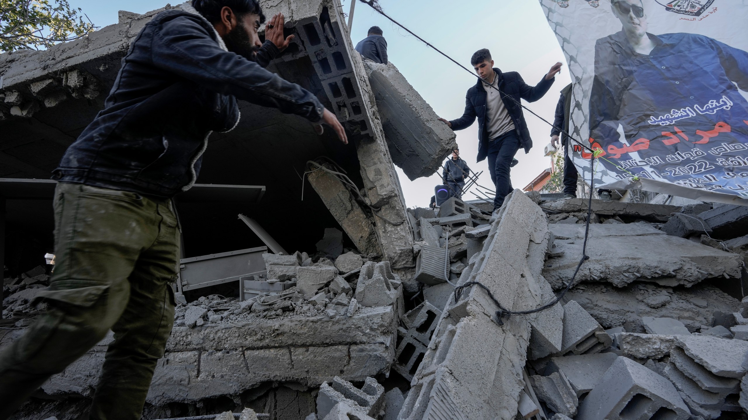 Palestinians inspect the ruins of the house of Palestinian militant, Mohammad Souf, that was demolished by Israeli troops in the West Bank village of Haris, Wednesday, May 3, 2023. Israeli forces demolish the house of a Palestinian man who killed three Israelis in an attack in the occupied West Bank settlement of Ariel in November 2022. Mohammad Souf, 18, stabbed two people, then stole a car and rammed it into a third person before he was shot dead by Israeli security forces. (AP Photo/Majdi Mohammed)