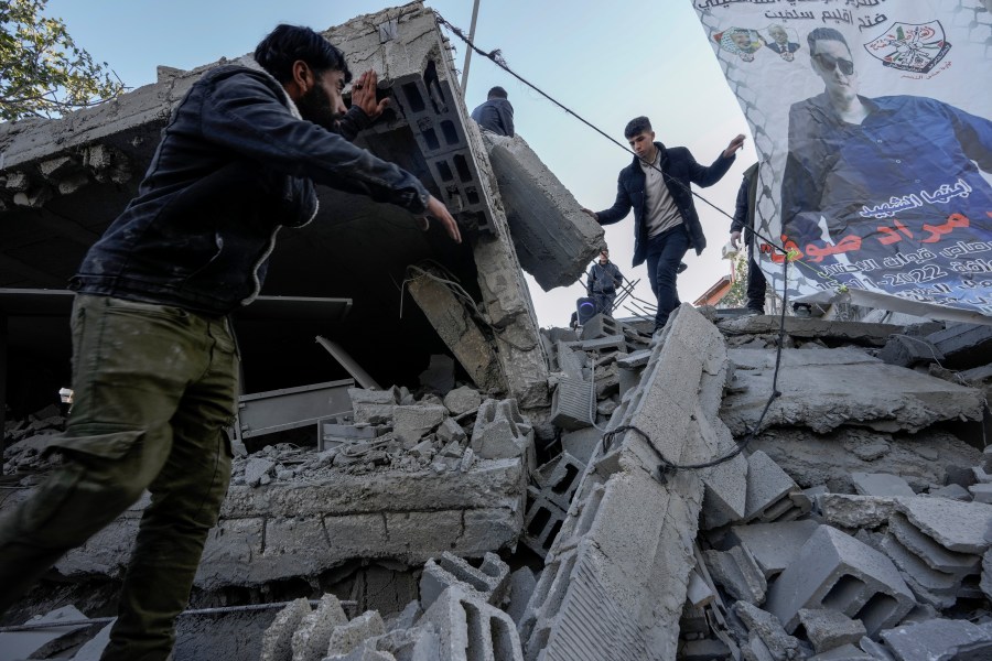 Palestinians inspect the ruins of the house of Palestinian militant, Mohammad Souf, that was demolished by Israeli troops in the West Bank village of Haris, Wednesday, May 3, 2023. Israeli forces demolish the house of a Palestinian man who killed three Israelis in an attack in the occupied West Bank settlement of Ariel in November 2022. Mohammad Souf, 18, stabbed two people, then stole a car and rammed it into a third person before he was shot dead by Israeli security forces. (AP Photo/Majdi Mohammed)