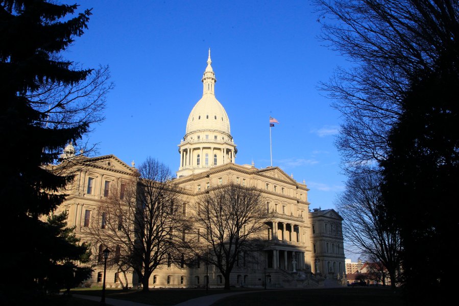 FILE - The Michigan Capitol building stands in Lansing, Mich., Dec. 12, 2012. Michigan Democrats continued efforts to protect abortion rights Wednesday, May 3, 2023, as the state Legislature advanced a bill that would outlaw companies from retaliating against employees for receiving abortions. (AP Photo/Carlos Osorio, File)