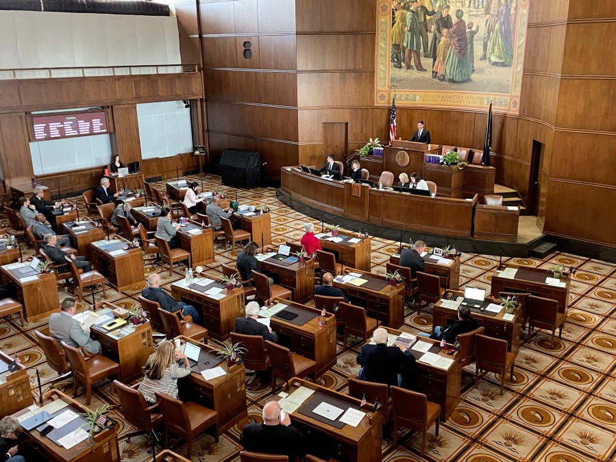 FILE - The Oregon state Senate convenes for the first day of the legislative session on Jan. 17, 2023, at the state Capitol in Salem, Ore. Republicans were absent from the Oregon state Senate, Wednesday, May 3, 2023, heightening partisan tensions ahead of planned votes on abortion and gun control bills. (AP Photo/Claire Rush, File)